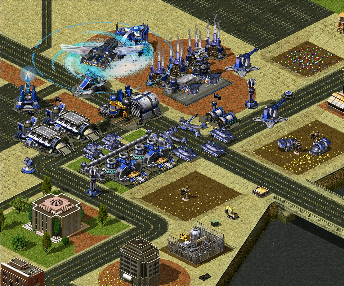 Isometrische Ansicht einer blauen futuristischen Basis mit Panzern, Türmen und einem fliegenden Flugzeug im Command & Conquer: Yuri's Revenge Mod