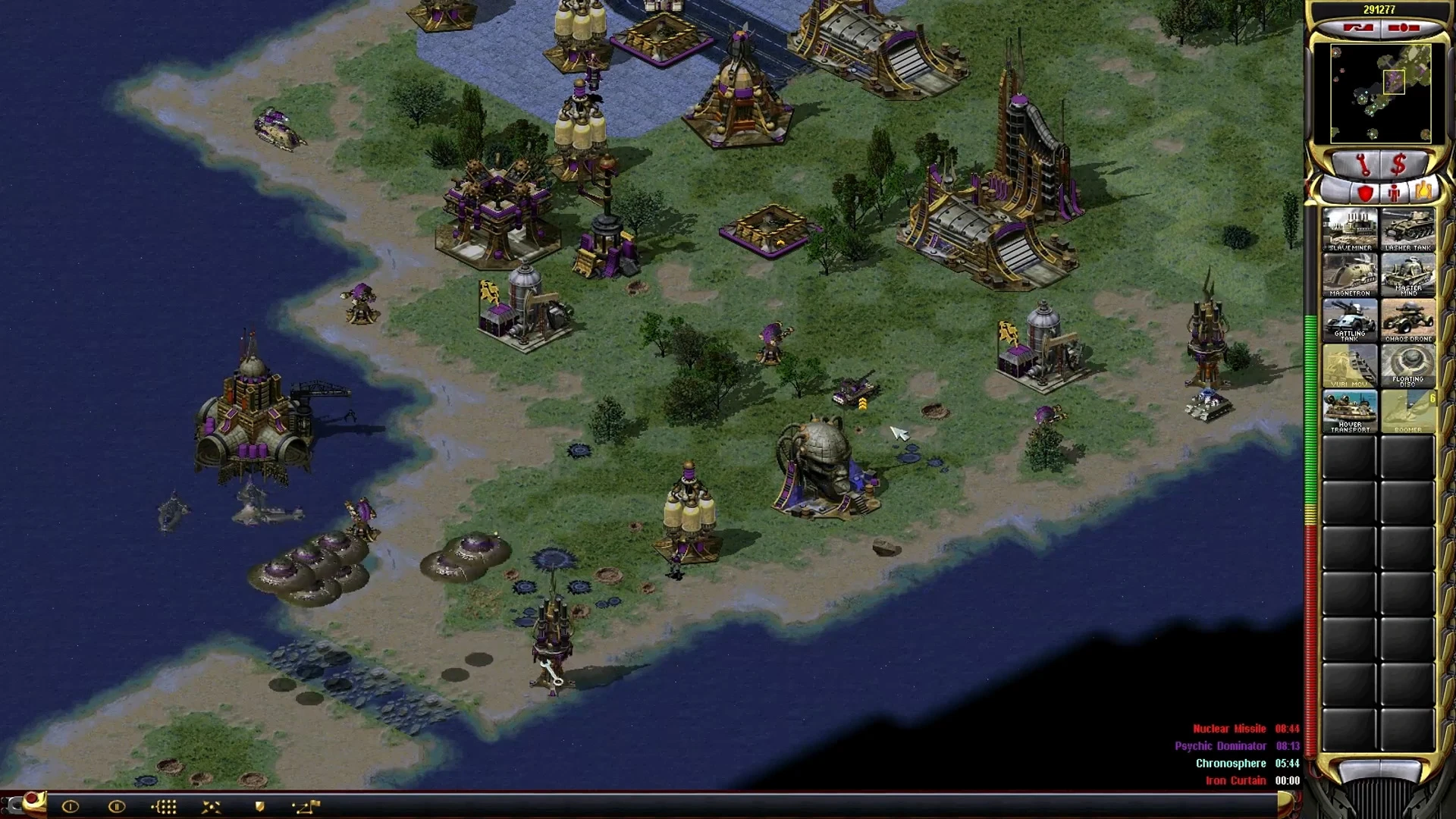 Screenshot of a base with buildings and units by the water in Command & Conquer Yuri's Revenge Yuri Resurgence Campaign mod