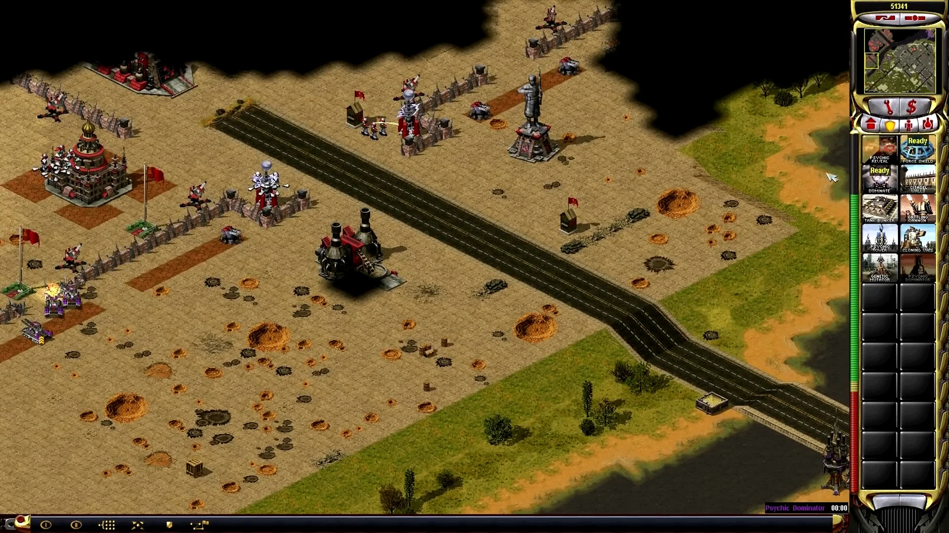 Screenshot of a tense base defense with walls, soldiers, and structures in Yuri Resurgence Campaign mod
