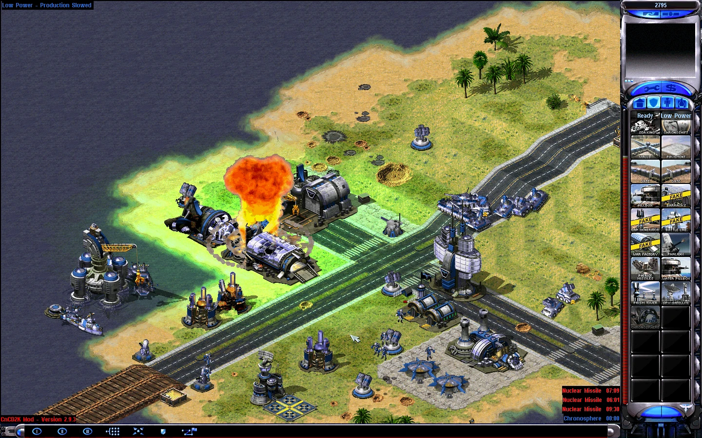 Вид внутри игры Command & Conquer Yuri's Revenge с модом CnCD2K с постройками, юнитами и взрывом возле электростанции
