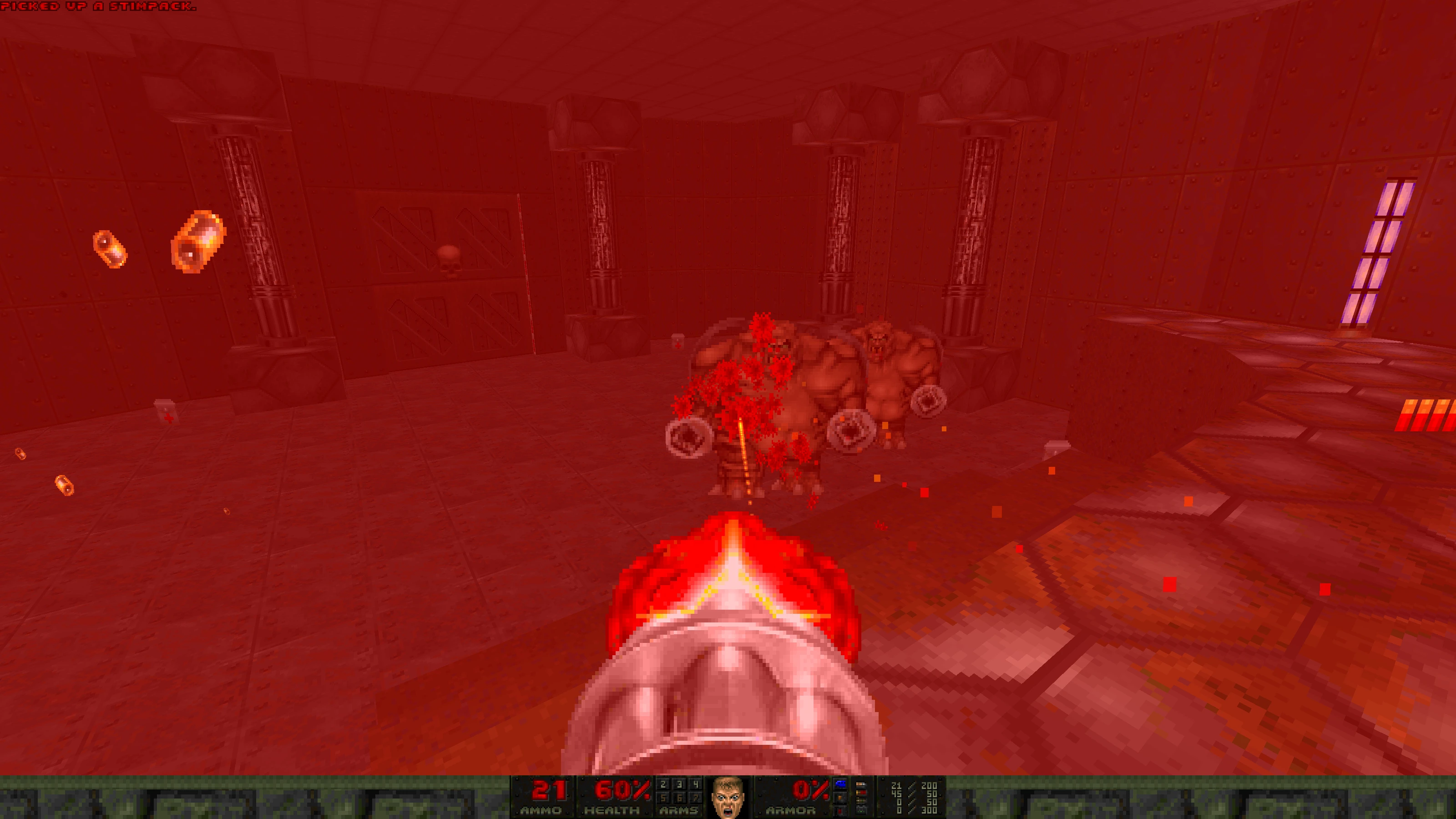 Player firing a chaingun at two heavy enemies in a red-lit metal room in Doom II mod Babel