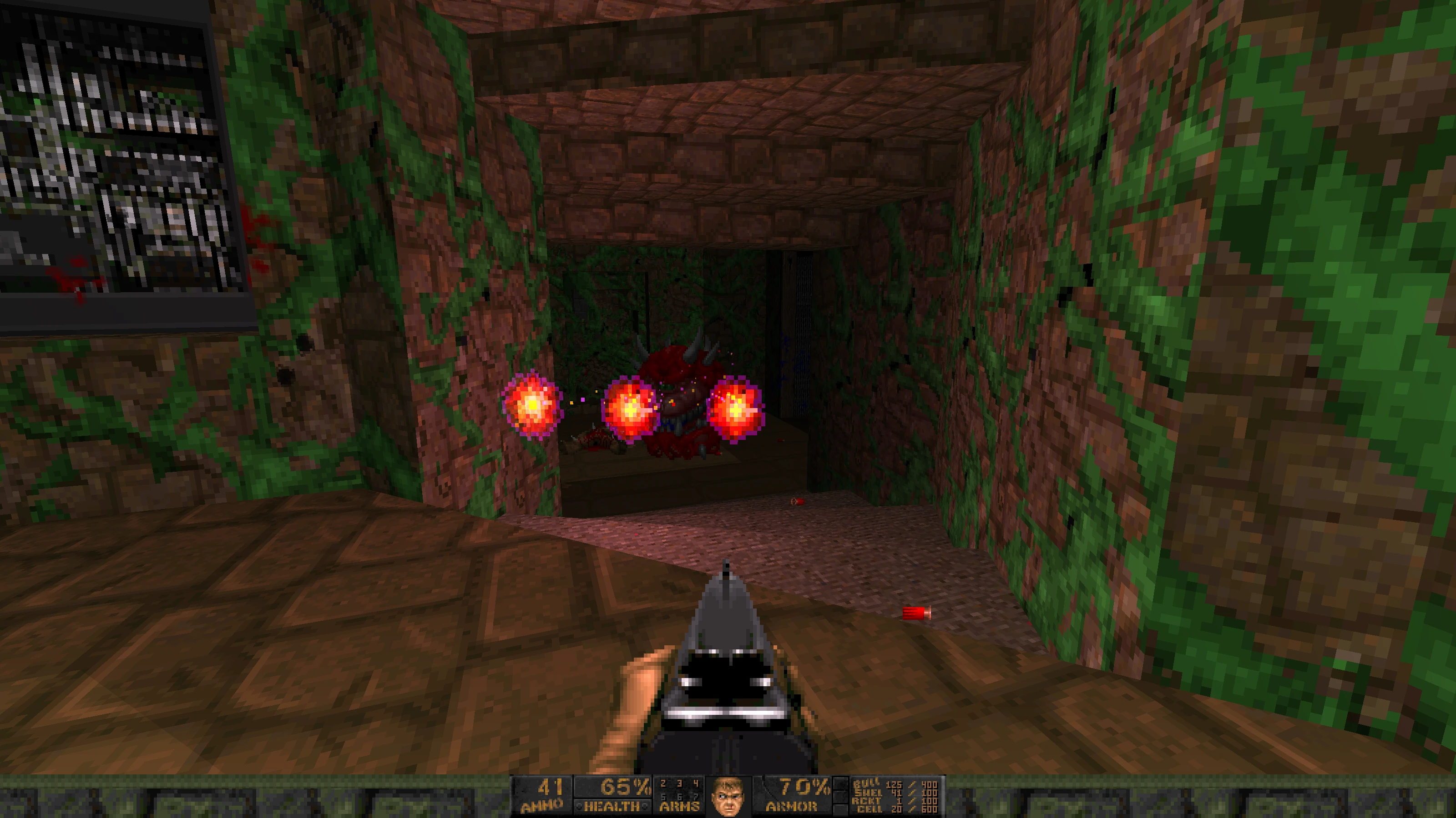 Player firing shotgun at a charging cacodemon in a narrow vine-covered stone corridor from Doom II mod Babel