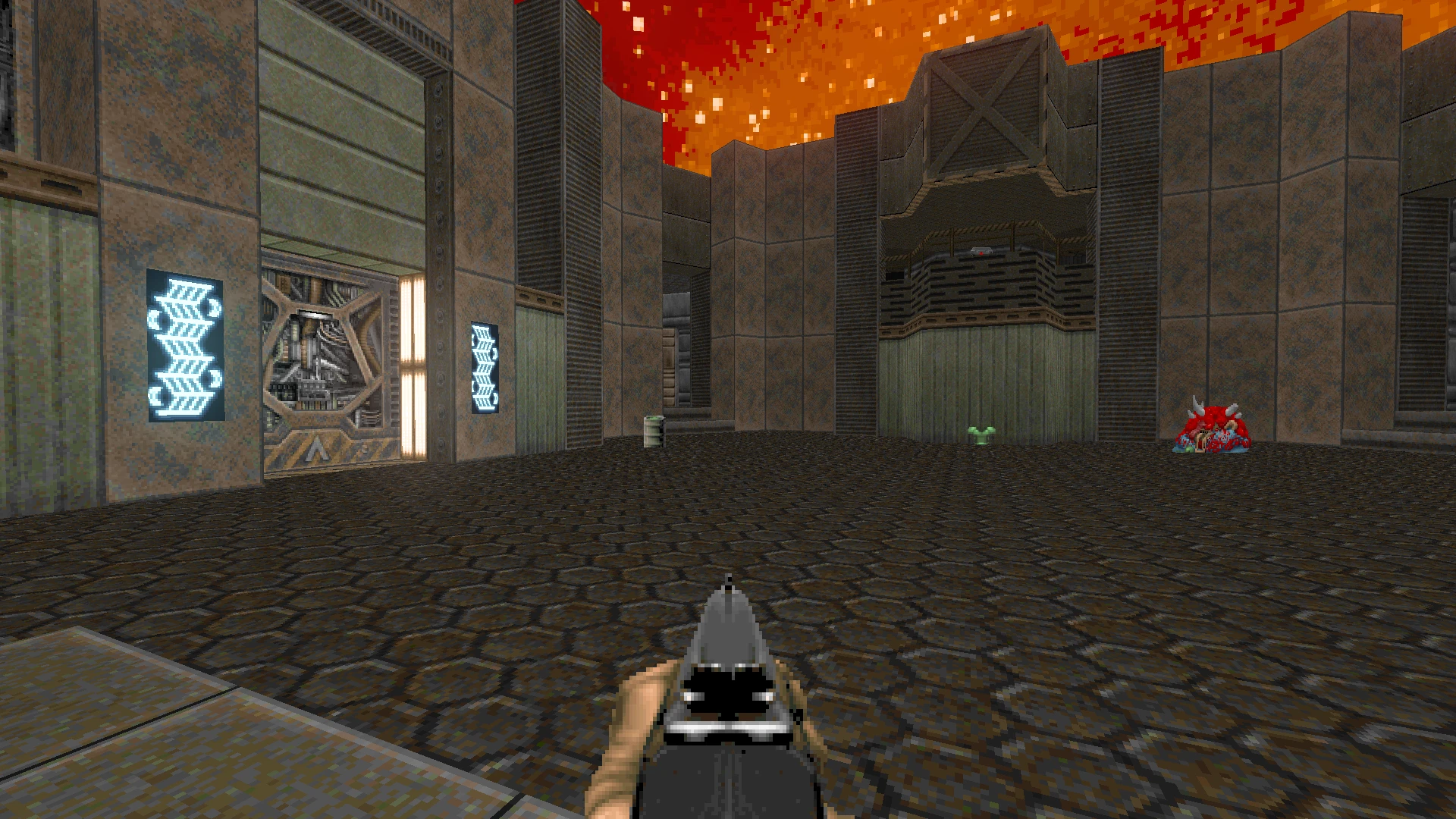 Vista en primera persona en el mod Doom II Back to Saturn X mostrando un patio futurista bajo un cielo rojo