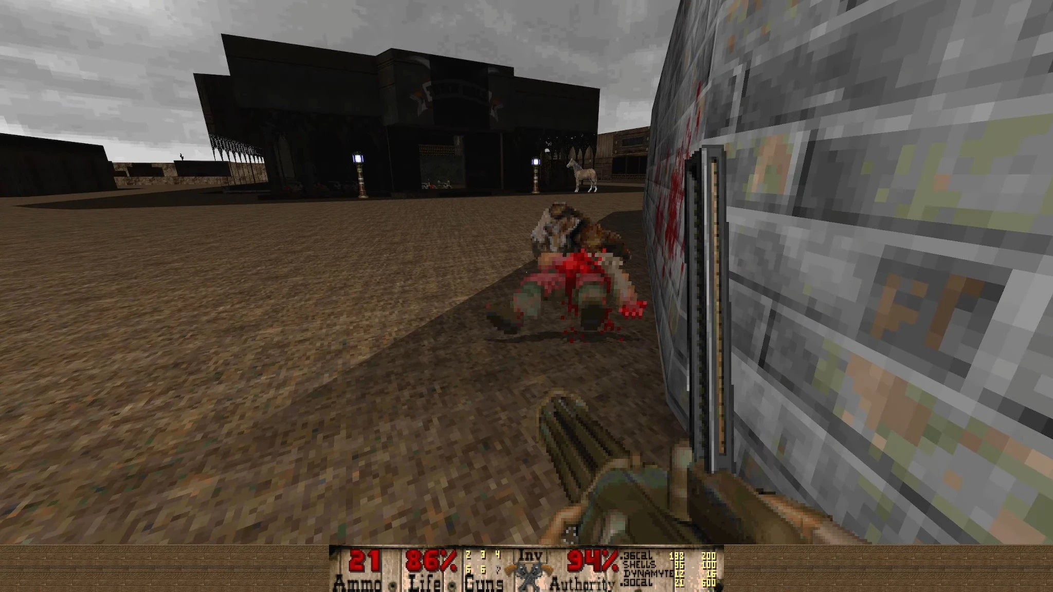 Gameplay scene from Doom II Bastardos mod with a minigun in hand and a dead enemy near a stone wall