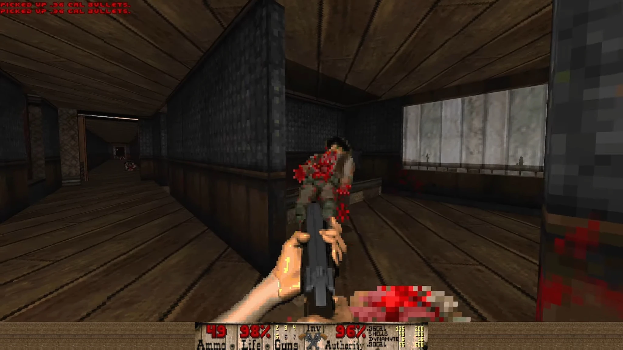 First-person view shooting an enemy in a wooden hallway with ammo and health stats visible at bottom