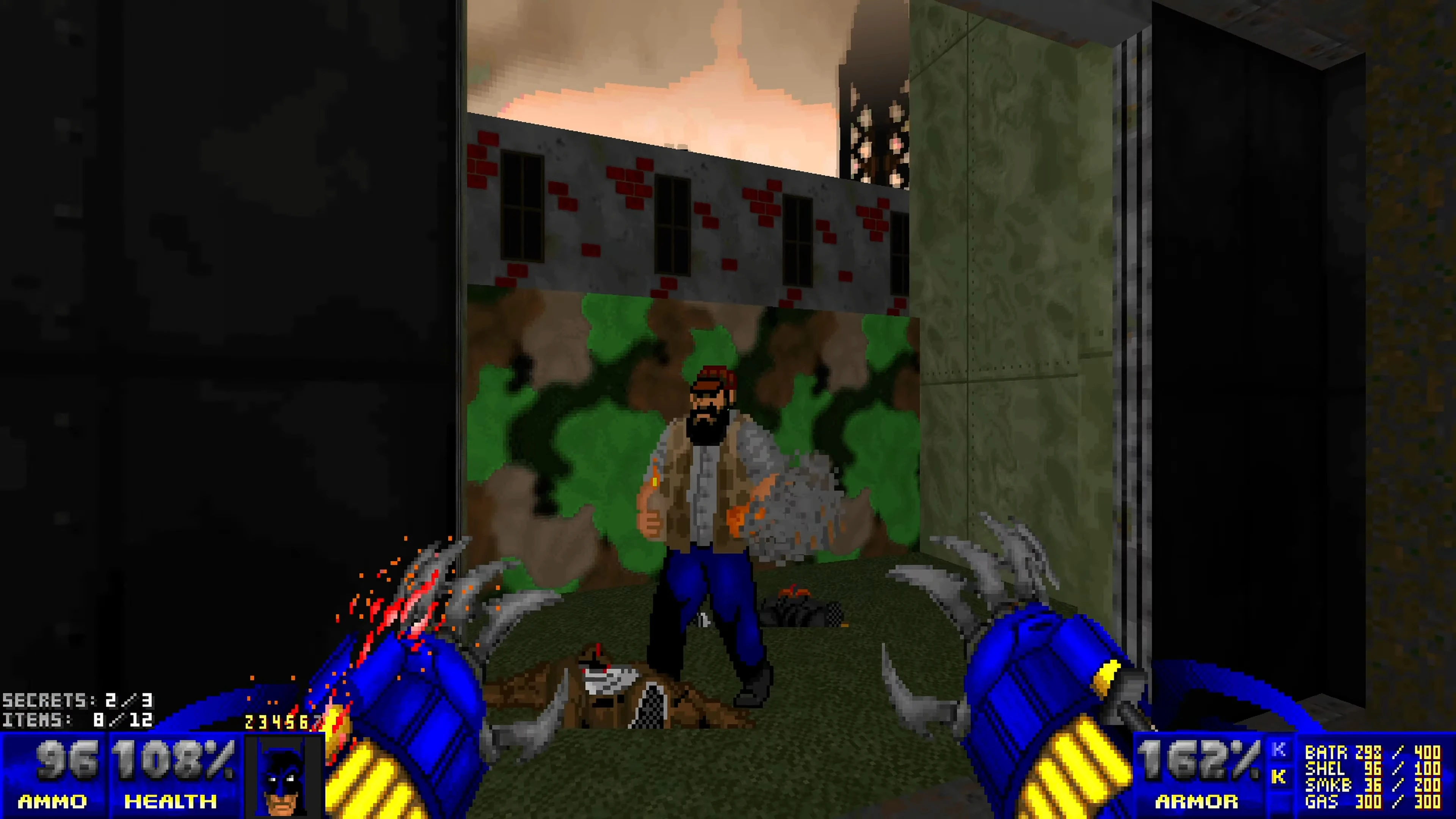 First-person view of player with blue claw weapons facing pixelated enemy in a vintage Doom II mod level