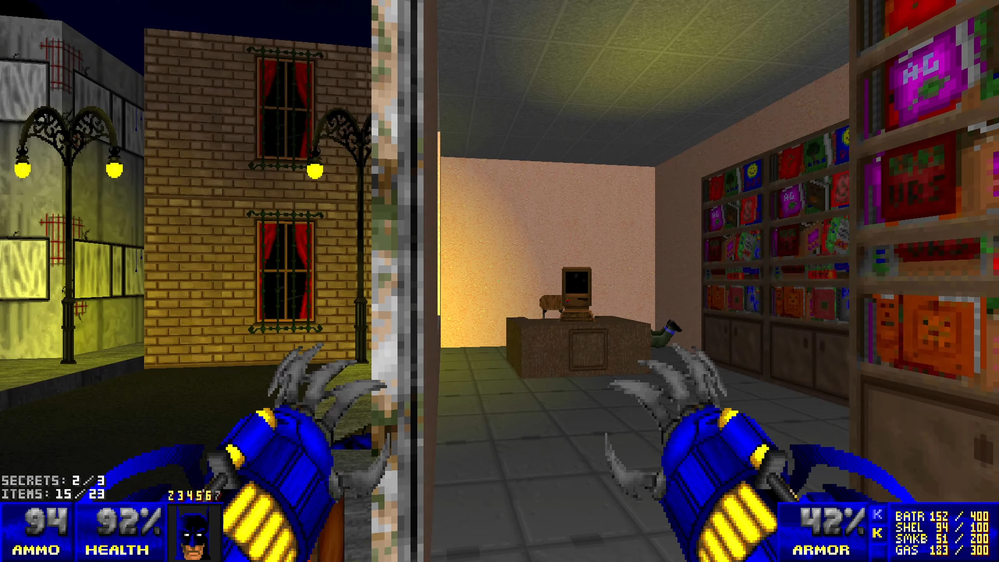 First-person view showing blue clawed hands, city street at night, and interior with computer and colorful posters in Doom II Batman mod