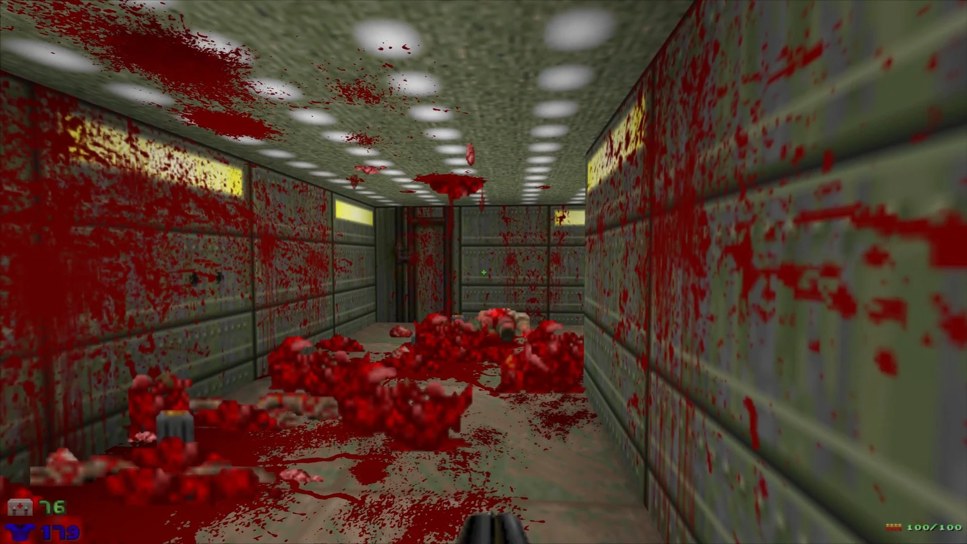 Doom II gameplay screenshot showing a hallway splattered with intense blood and gore using the Bolognese Gore Mod