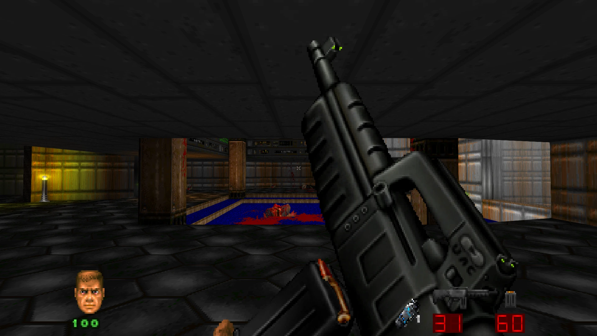 First-person view of a futuristic assault rifle held in a dark industrial Doom II environment with blood and ammo visible