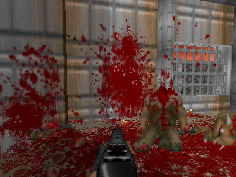 First-person view of shotgun shooting at heavily bloodied enemies with blood splattered on walls in Brutal Doom mod