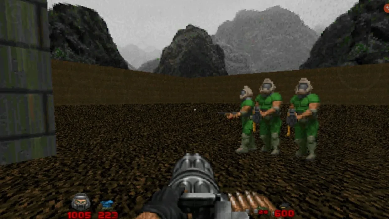 Player aiming a minigun at three enemies wearing green armor in an outdoor rocky environment in Doom II with Brutal Doom mod