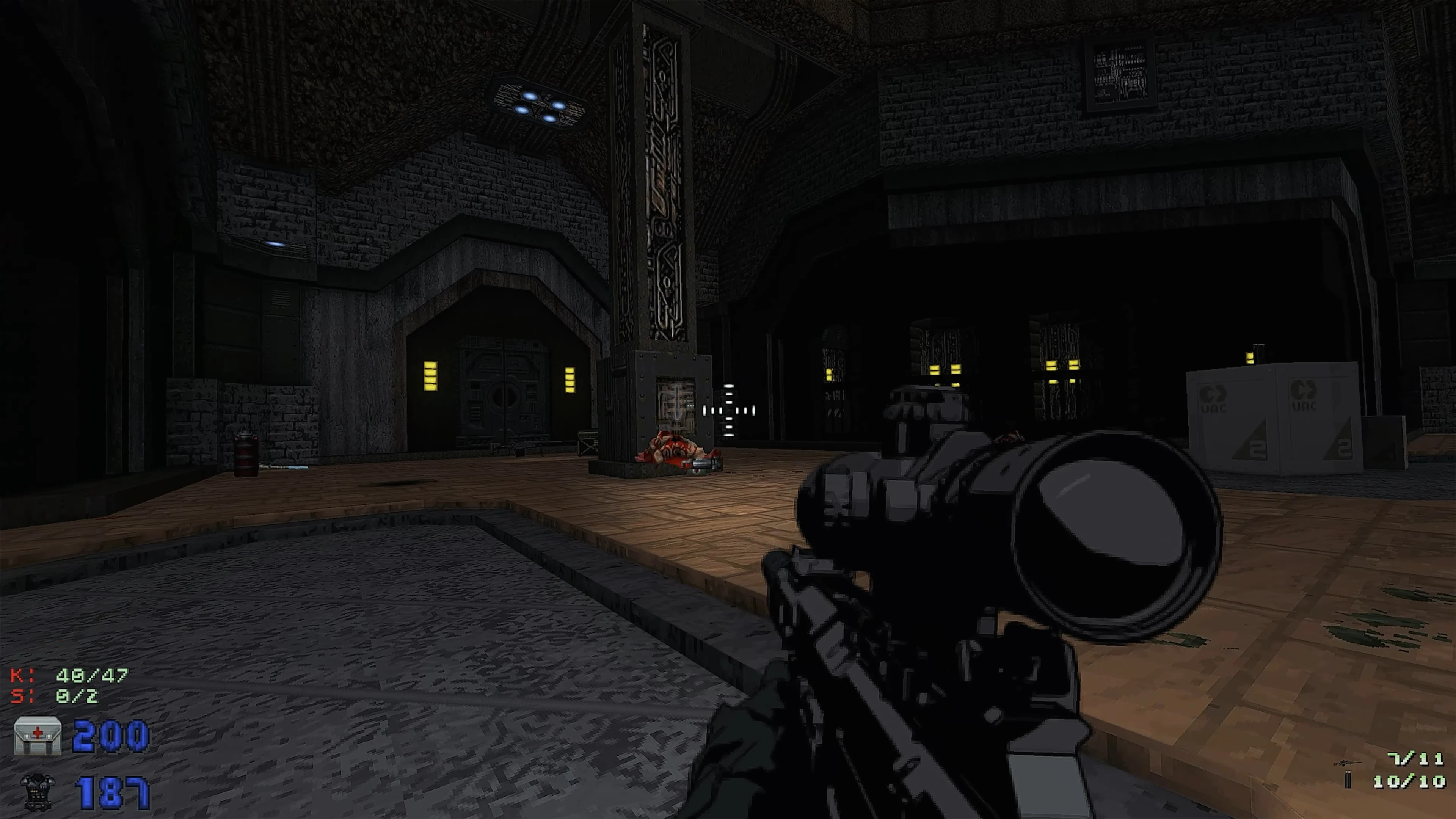 First-person view in a dimly lit industrial base showing a sniper rifle and a lifeless enemy on the floor in CALLSIGN: ZERO mod