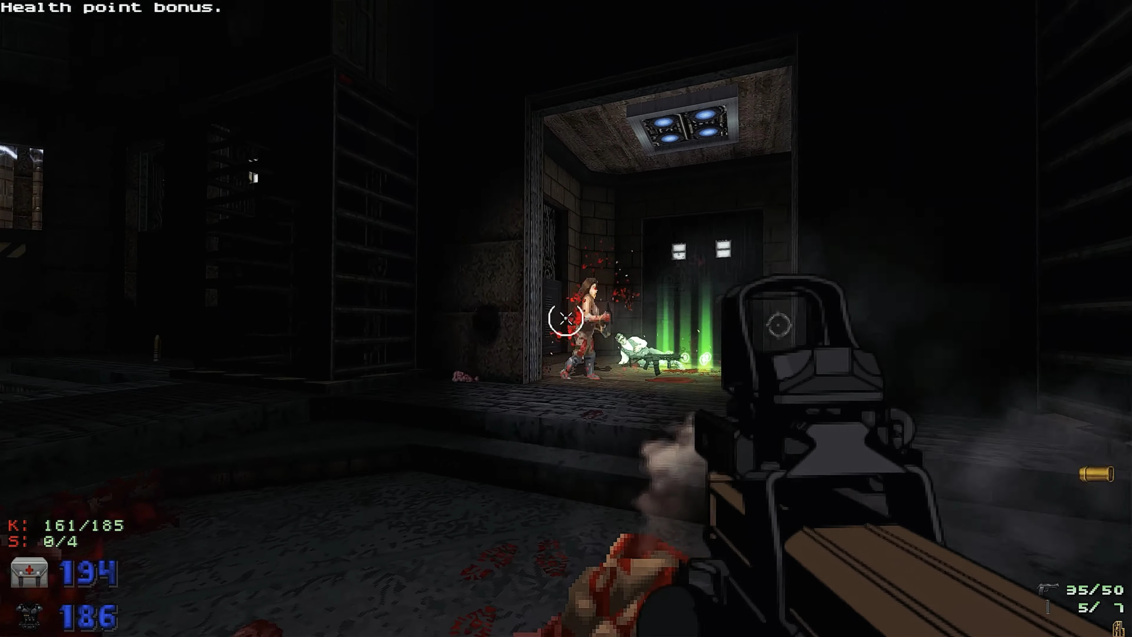 Player aiming with a gun in dark industrial setting, injured enemy on floor with green health pickups