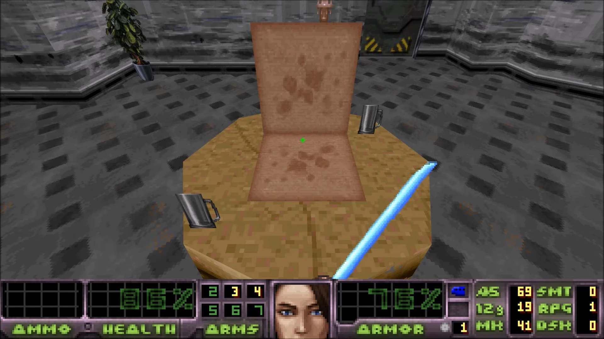 In-game screenshot of Doom II Dirty Pair mod showing stained chair, two mugs on table, and glowing blue melee weapon