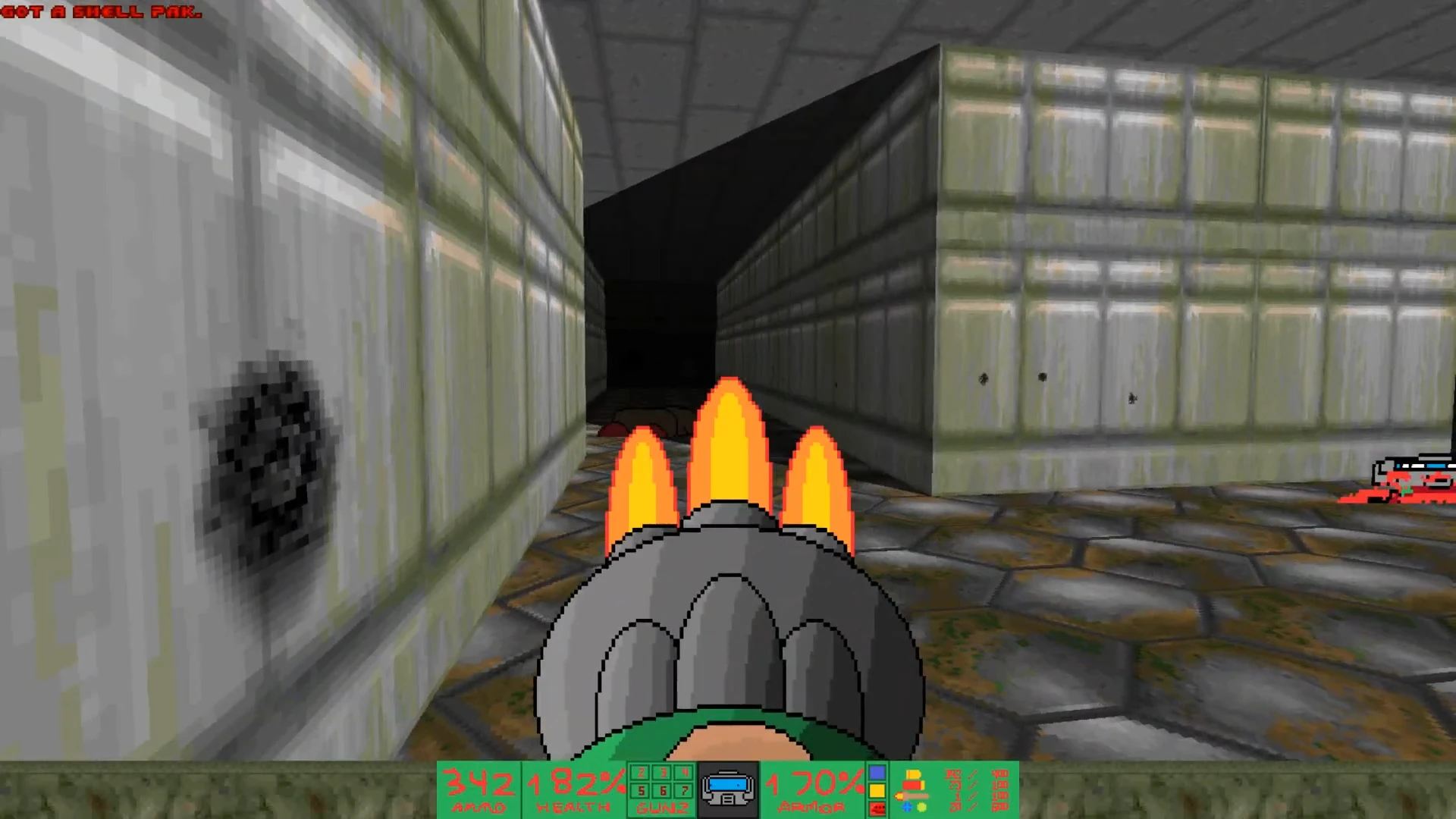 Vista en primera persona disparando una escopeta en un pasillo estrecho y oscuro en el mod DOOB de Doom II
