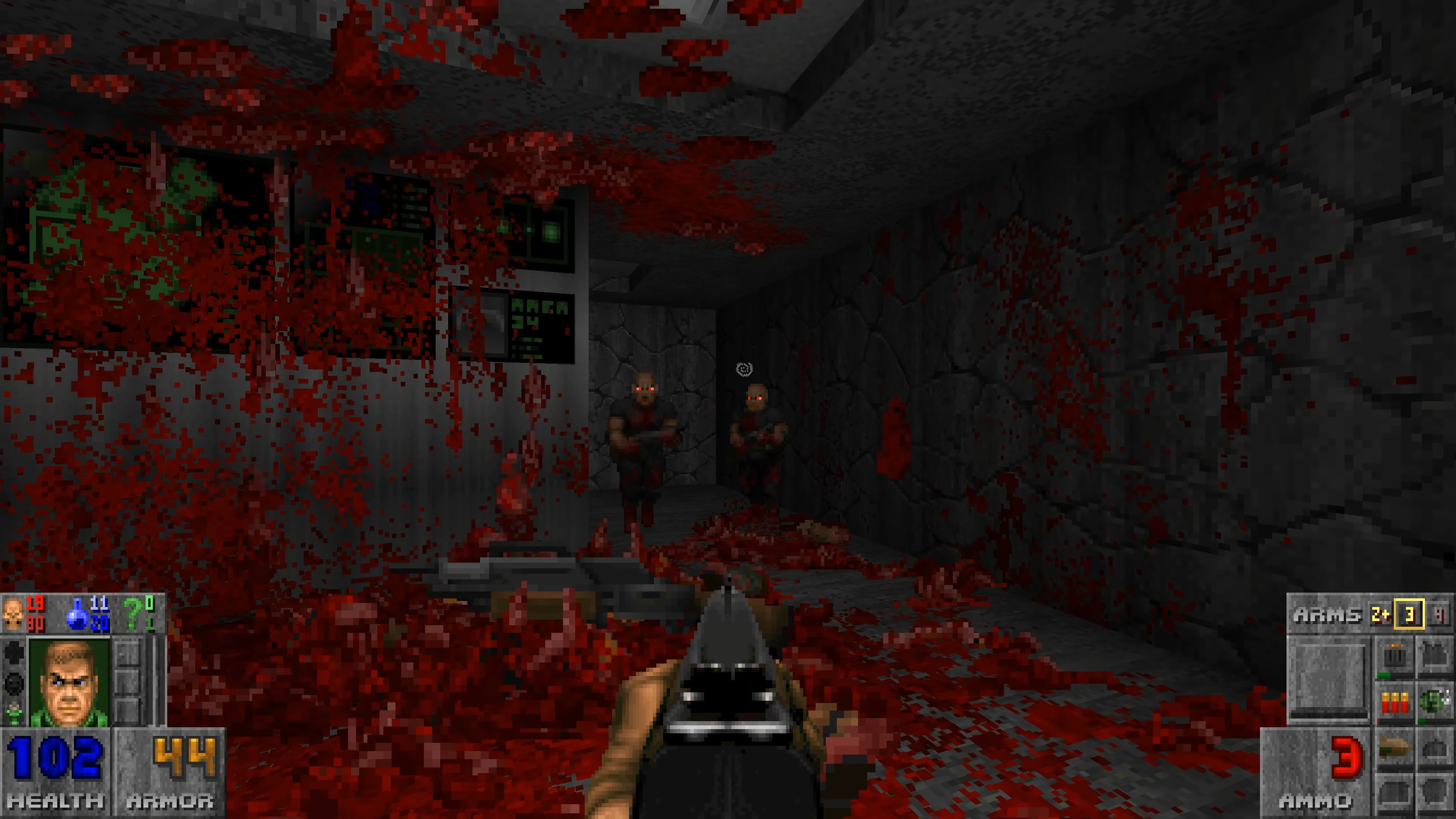 Вид від першої особи, що стріляє по двох морських піхотинцях Doom у темному кам'яному коридорі з численними бризками крові