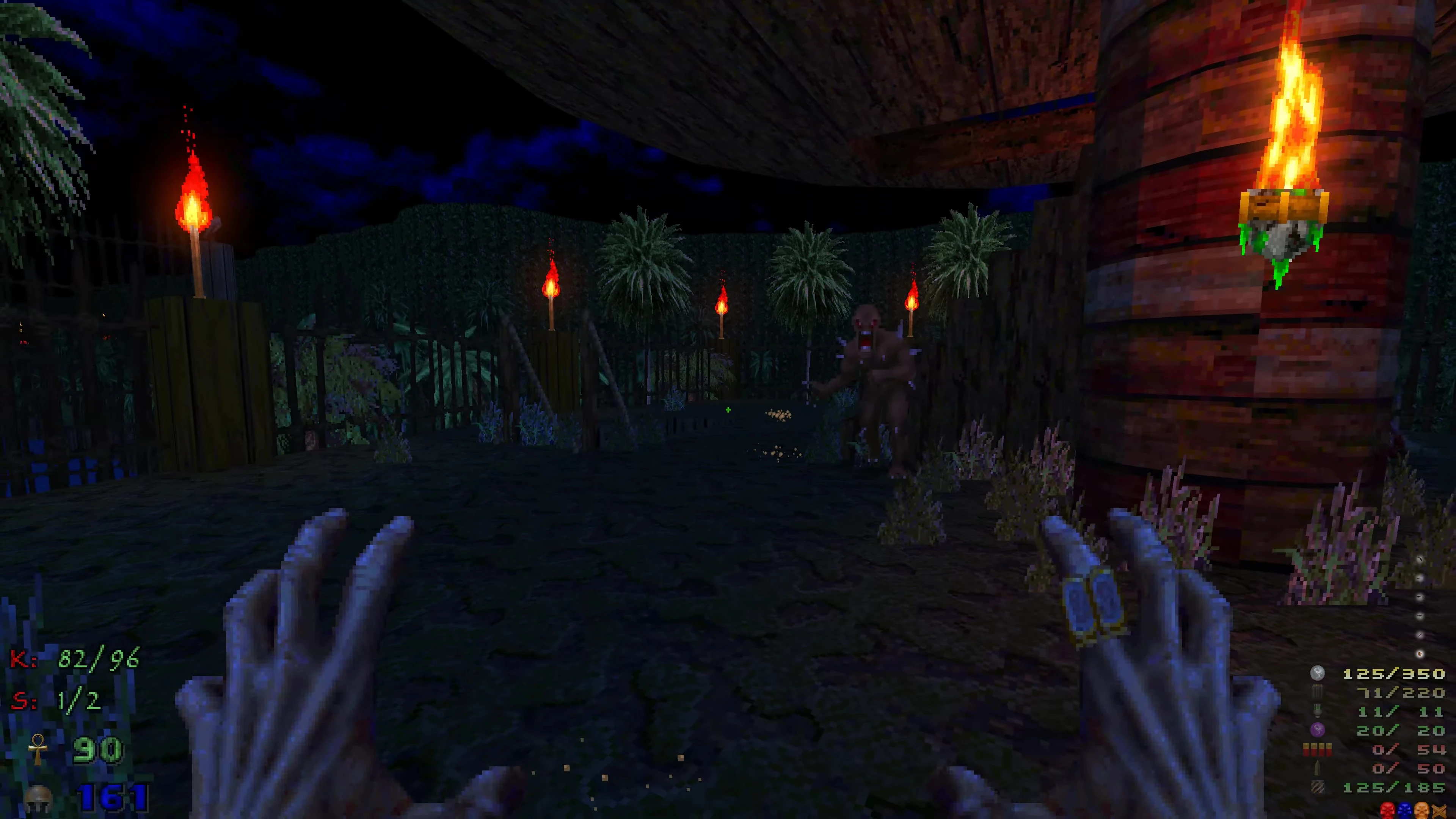 First-person view of player with hands raised facing a monster in a dark outdoor area lit by torches in DoomExhumed