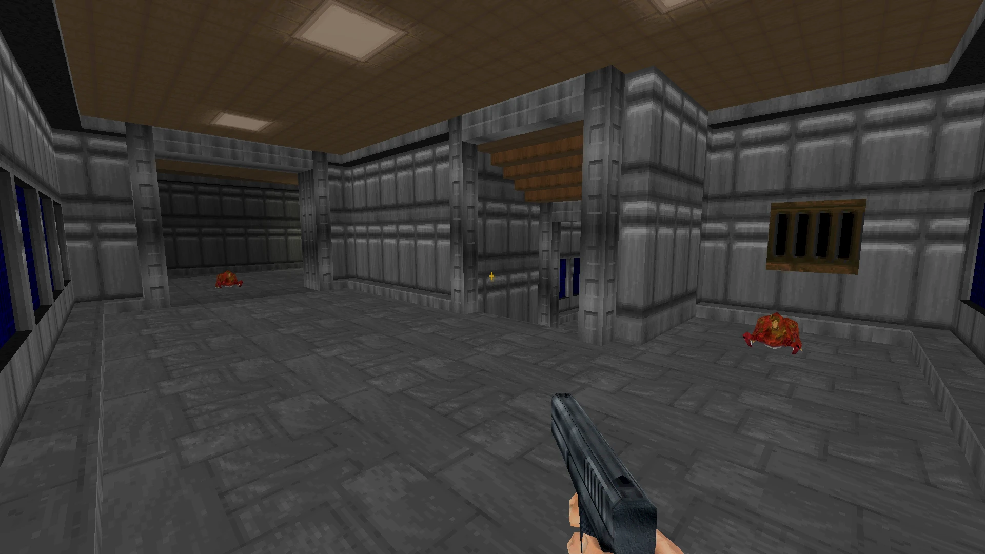 Escena de un pasillo del mod Half-Life: Alpha en el motor de Doom II, con una pistola y texturas industriales.