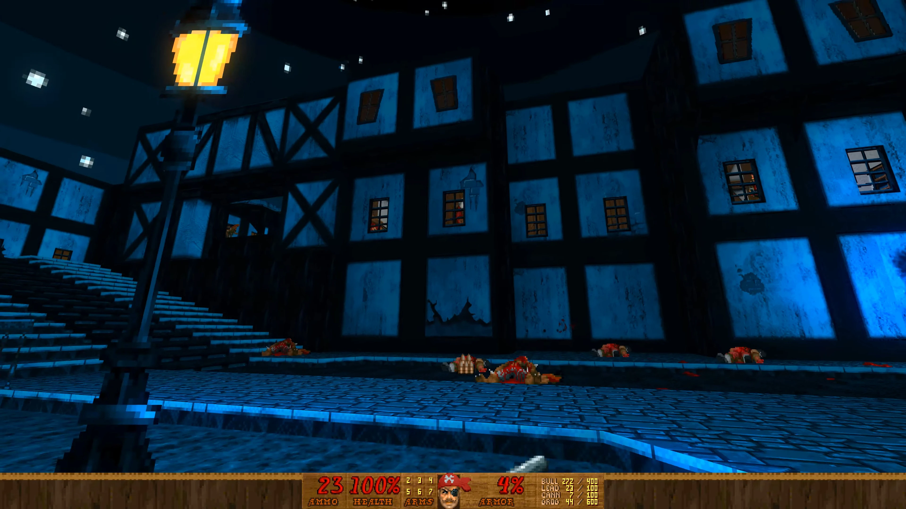 Doom II gameplay screenshot showing a dark village with blue half-timbered houses and pixelated streetlamp