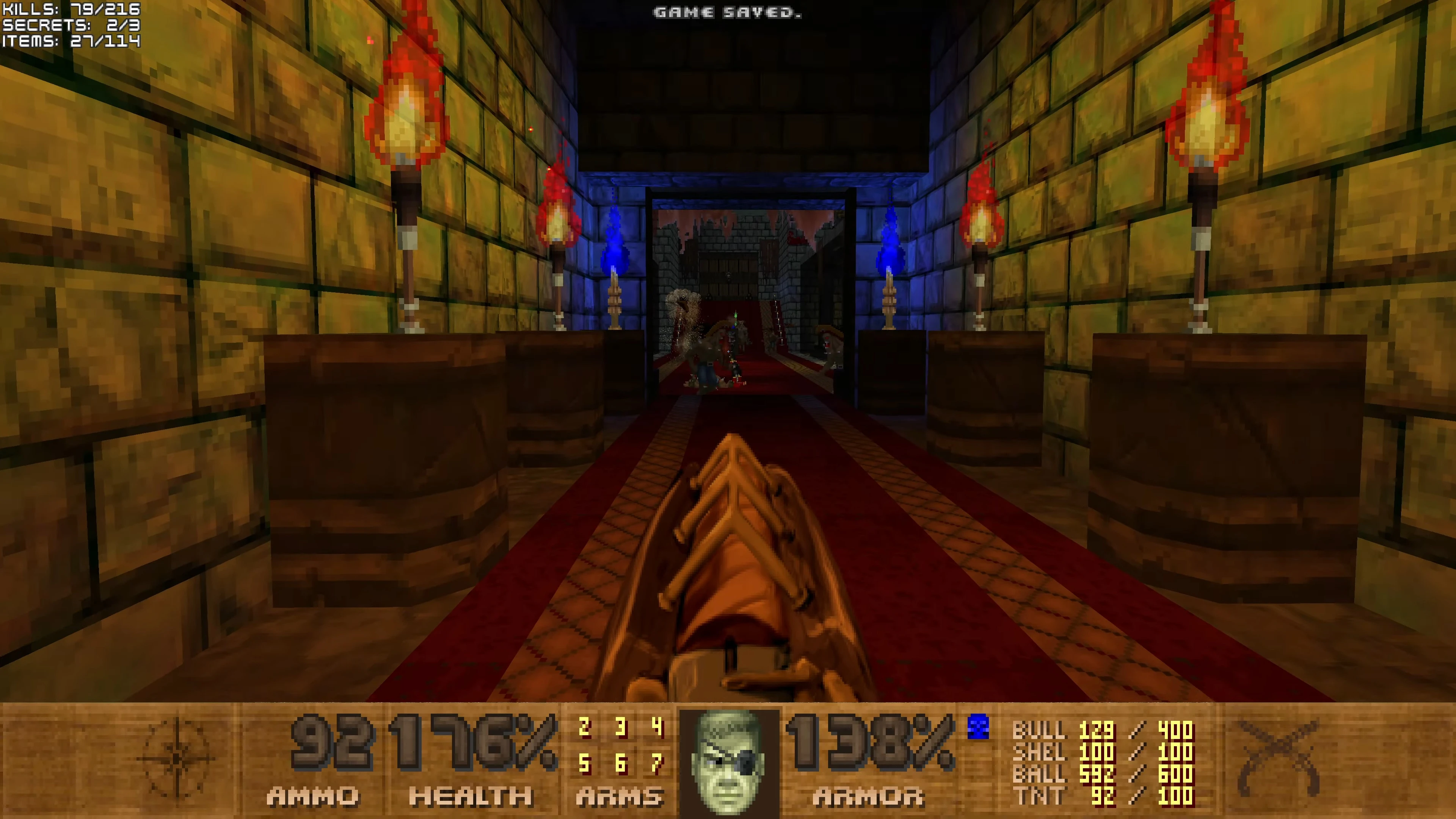 First-person view in Doom II Pirate Doom mod showing a weapon pointed down a torch-lit castle hallway