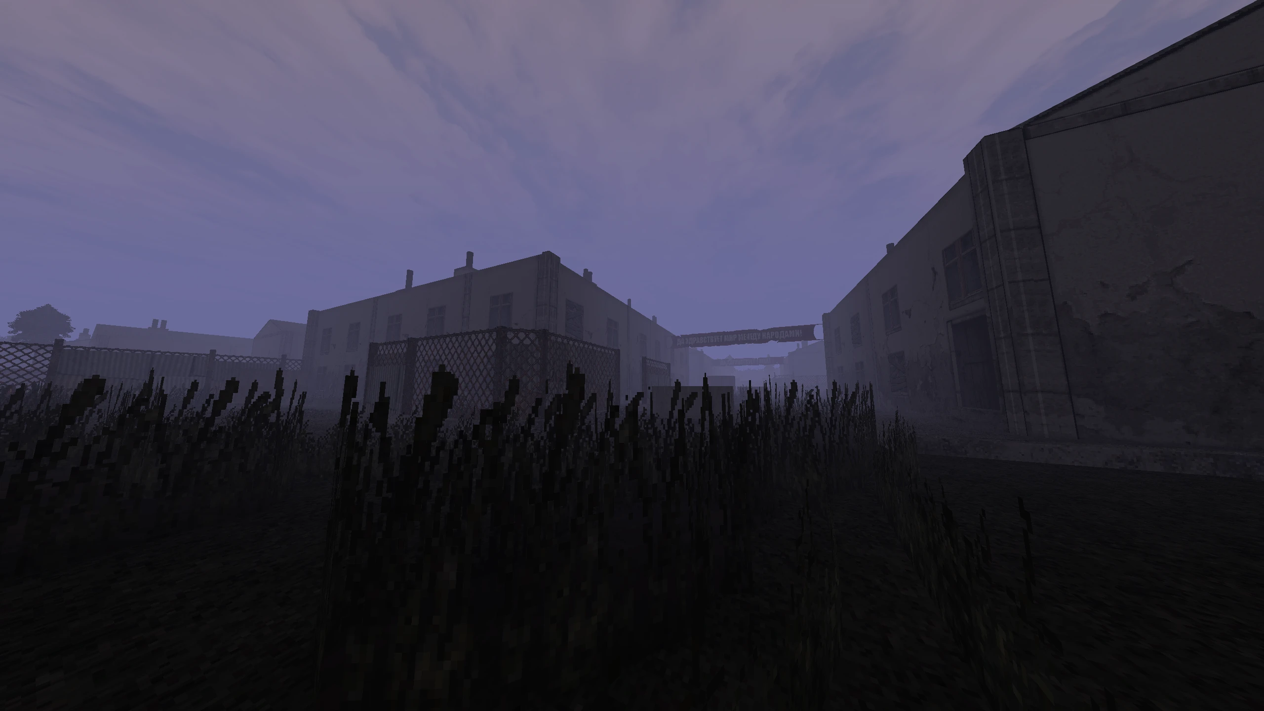Dark eerie streets and buildings under cloudy sky in Doom II Retrozone mod environment