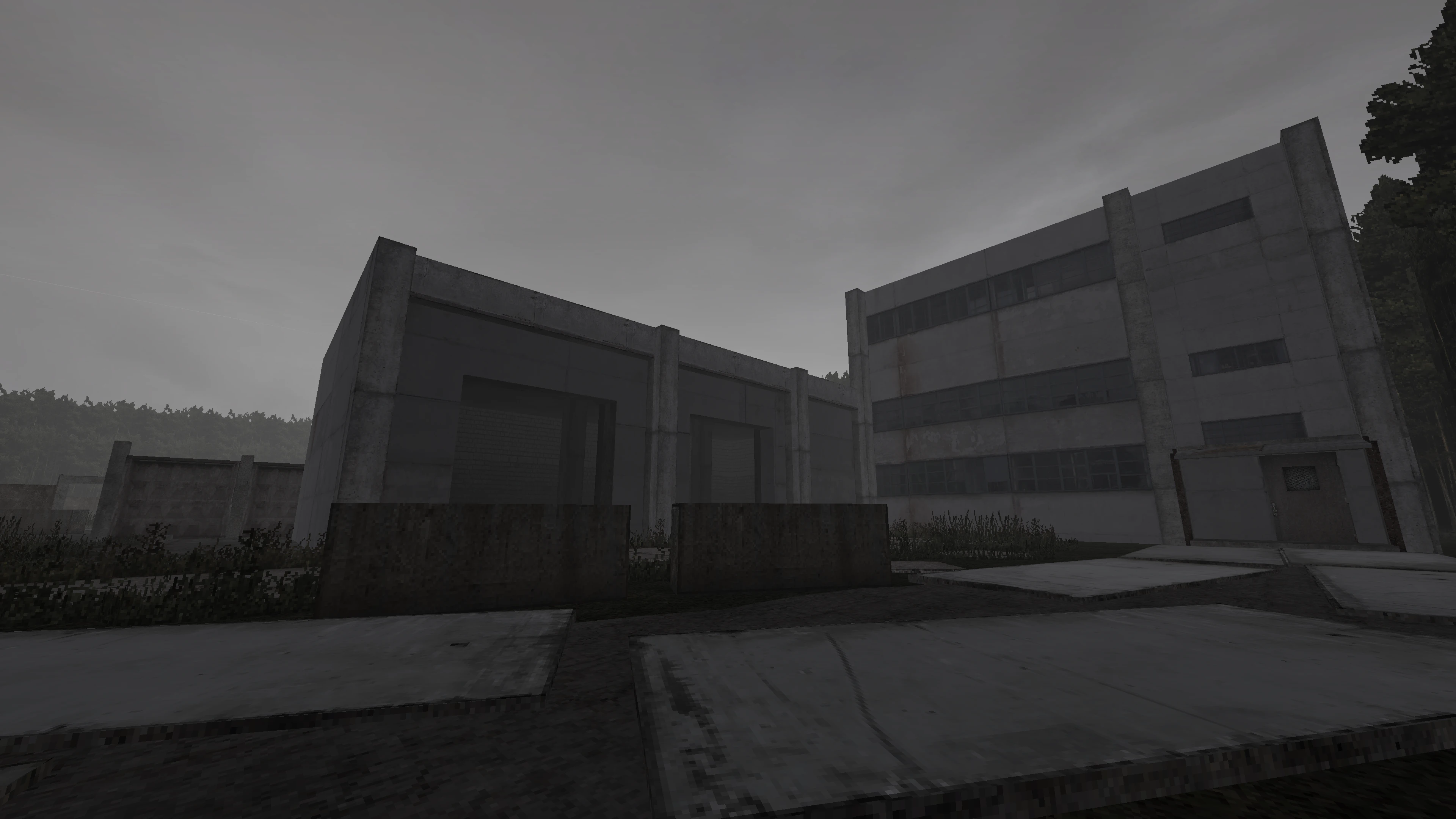 Dark gray concrete industrial buildings and overcast sky in Doom II Retrozone mod