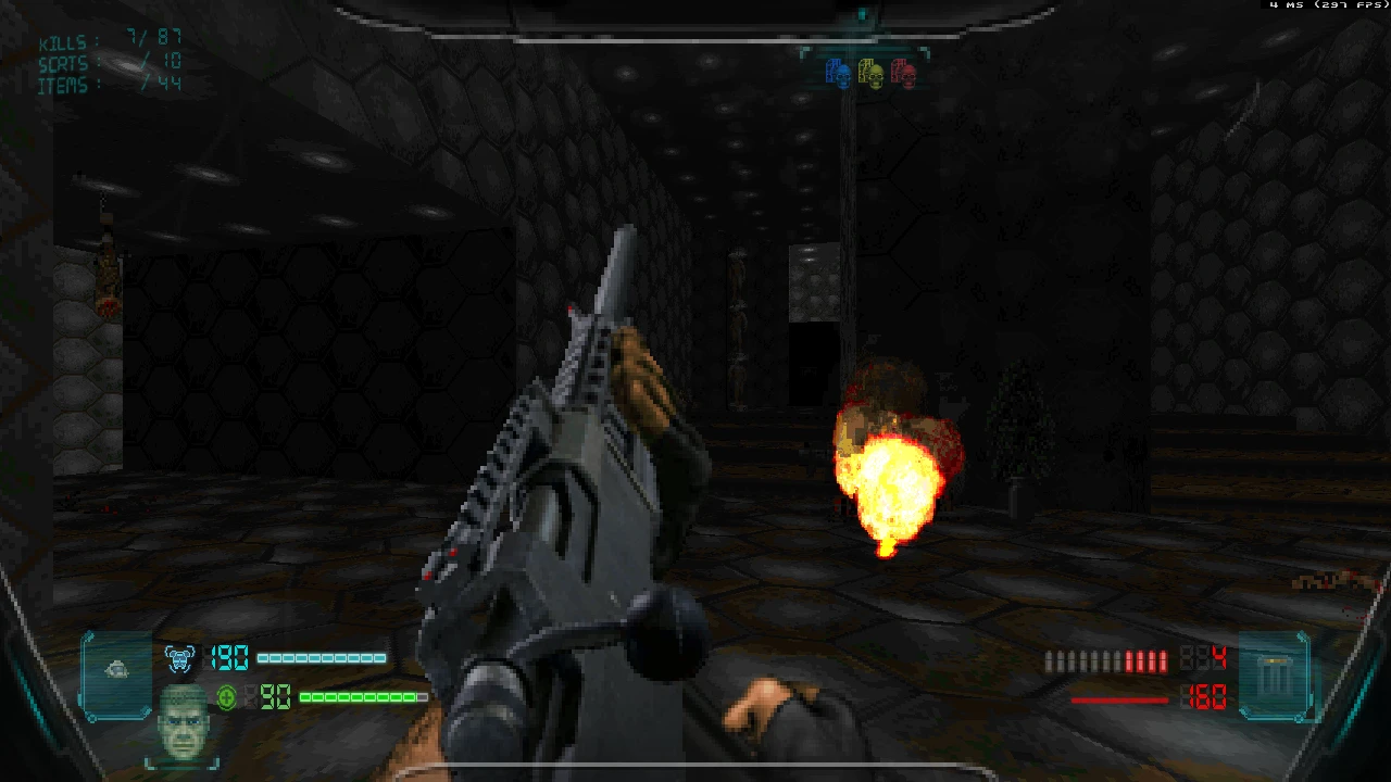 Вид від першої особи в моді Schism для Doom II, гравець тримає футуристичну зброю і стріляє по ворогах у темній кімнаті з шестикутними стінами