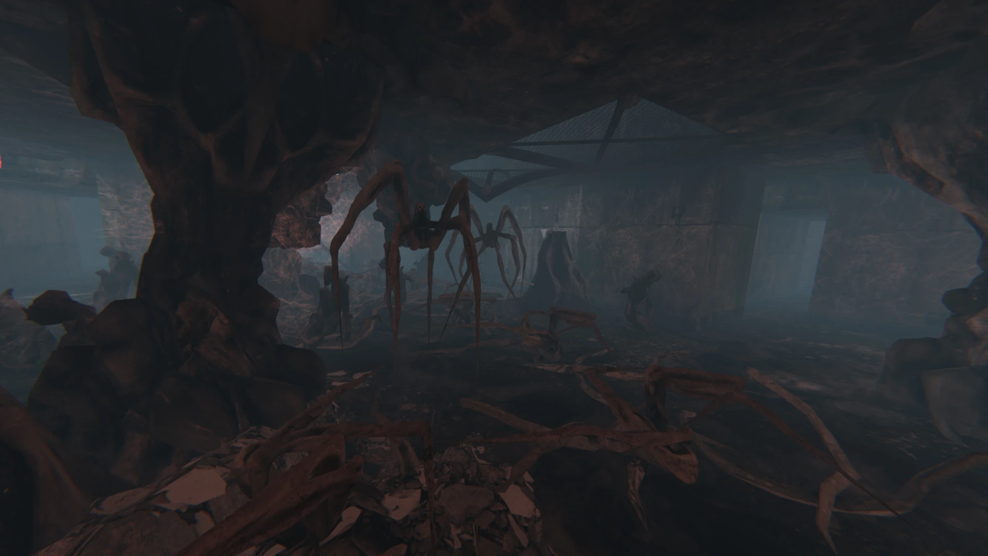 Gigantyczne pająkopodobne potwory przemierzają ciemną, skalistą jaskinię w modzie Doom II Total Chaos - Directors Cut