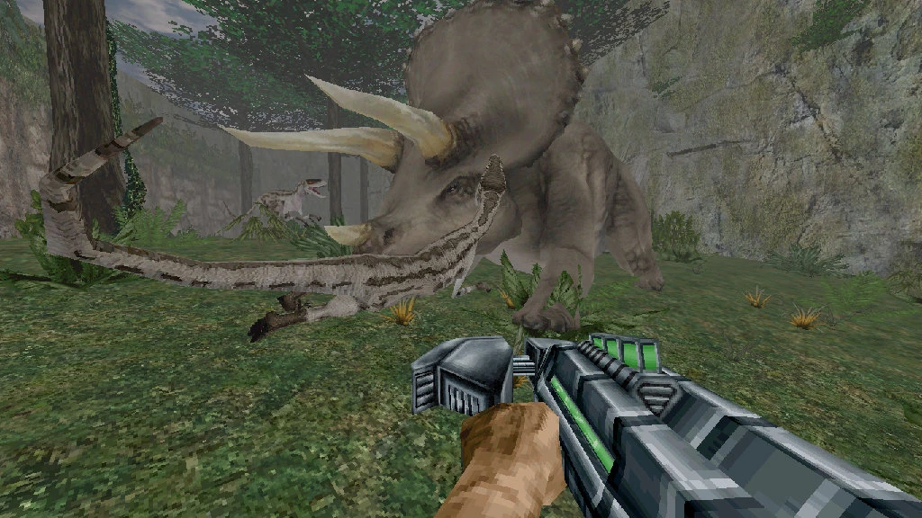 First-person view of player holding futuristic gun facing a triceratops and two velociraptors in forested canyon