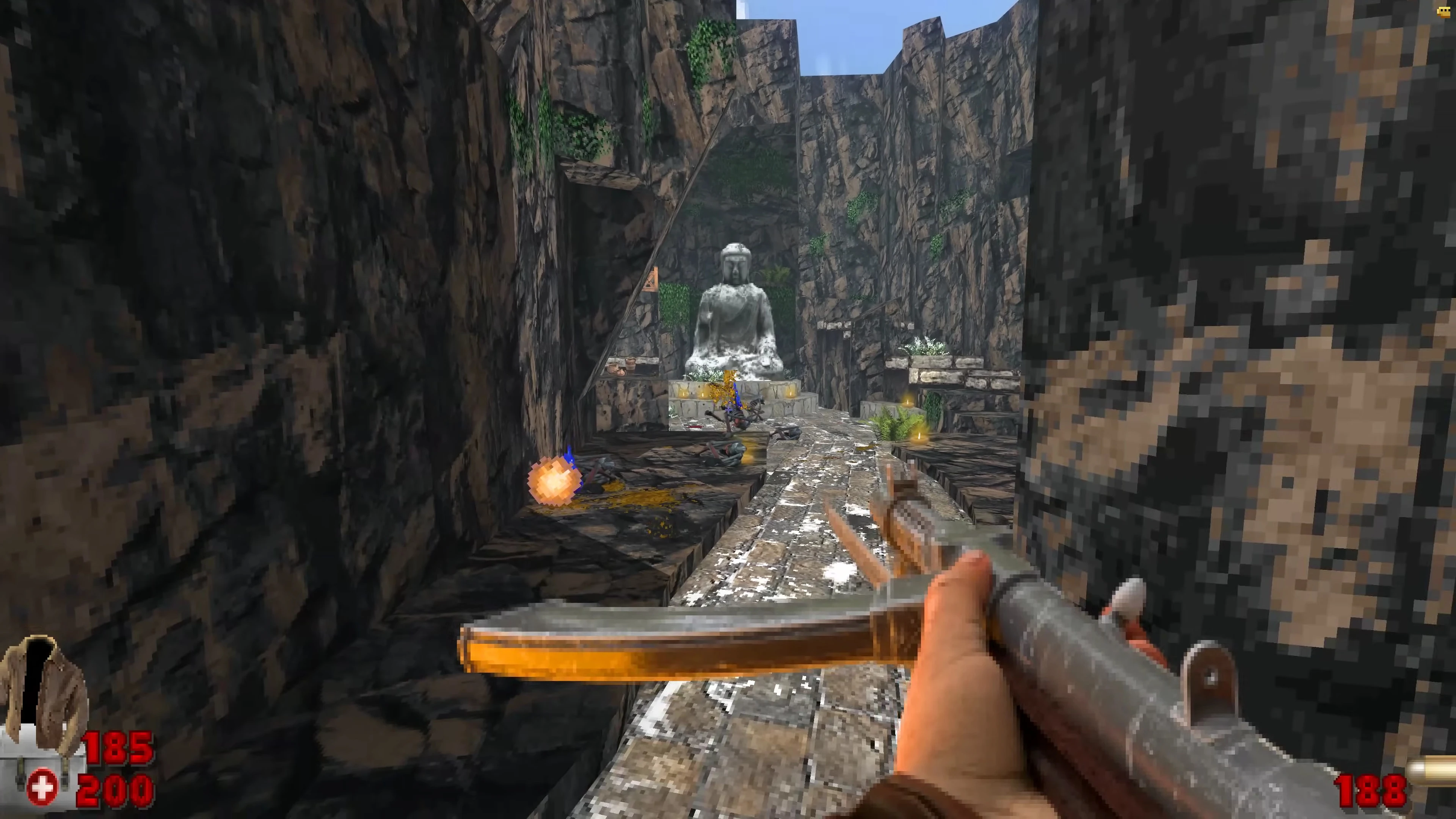 Vista en primera persona en mod Venturous de Doom II mostrando camino rocoso hacia una gran estatua de Buda
