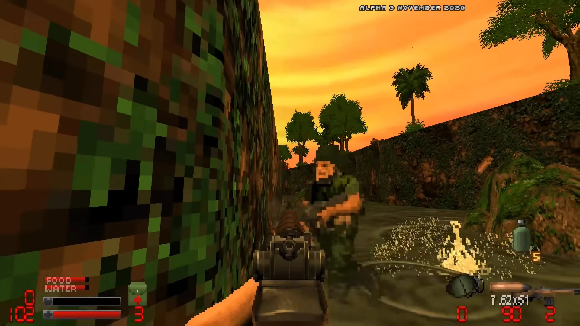 First-person view of a soldier aiming a gun at an enemy in a pixelated jungle environment during sunset