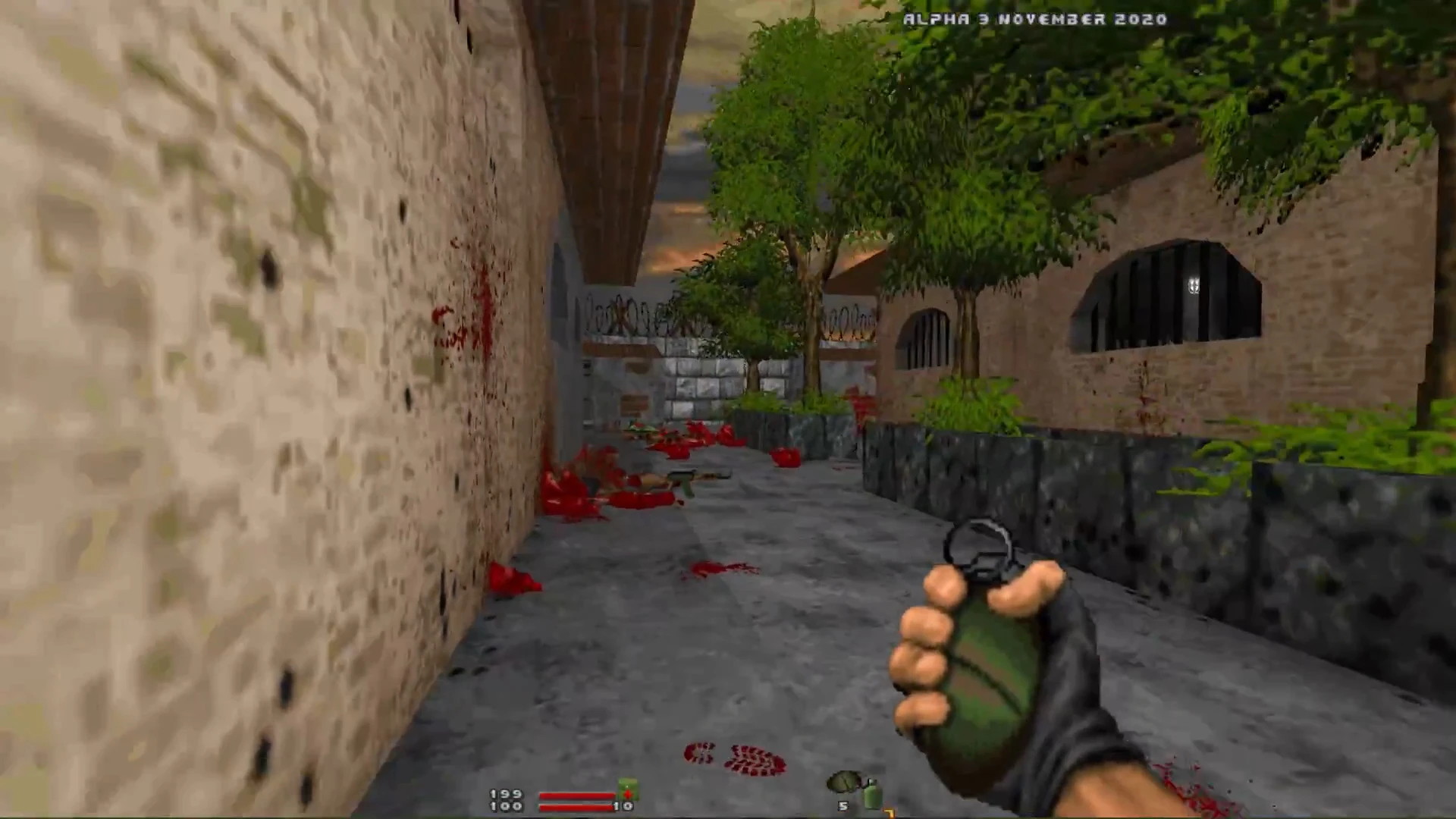 First-person view holding a grenade in a narrow alley with blood splatters and trees in Doom II VietDOOM mod