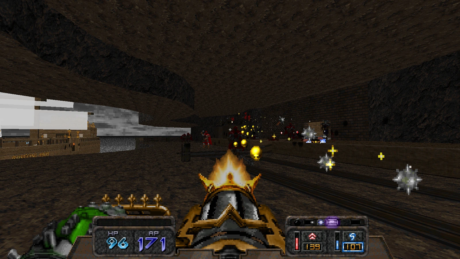 Gameplay-Screenshot von Doom 1993, der Waffenfeuer mit Spezialeffekten in einer dunklen Felskammer zeigt, mit dem GMOTA-Mod