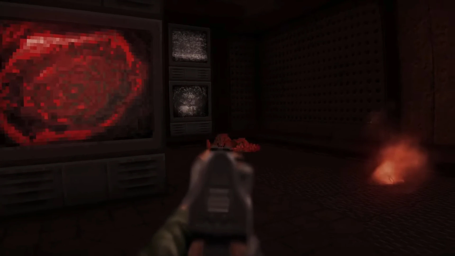 Player aiming gun at a dark room with red screens and smoke effects in Doom 1993 Lost in Darkness mod