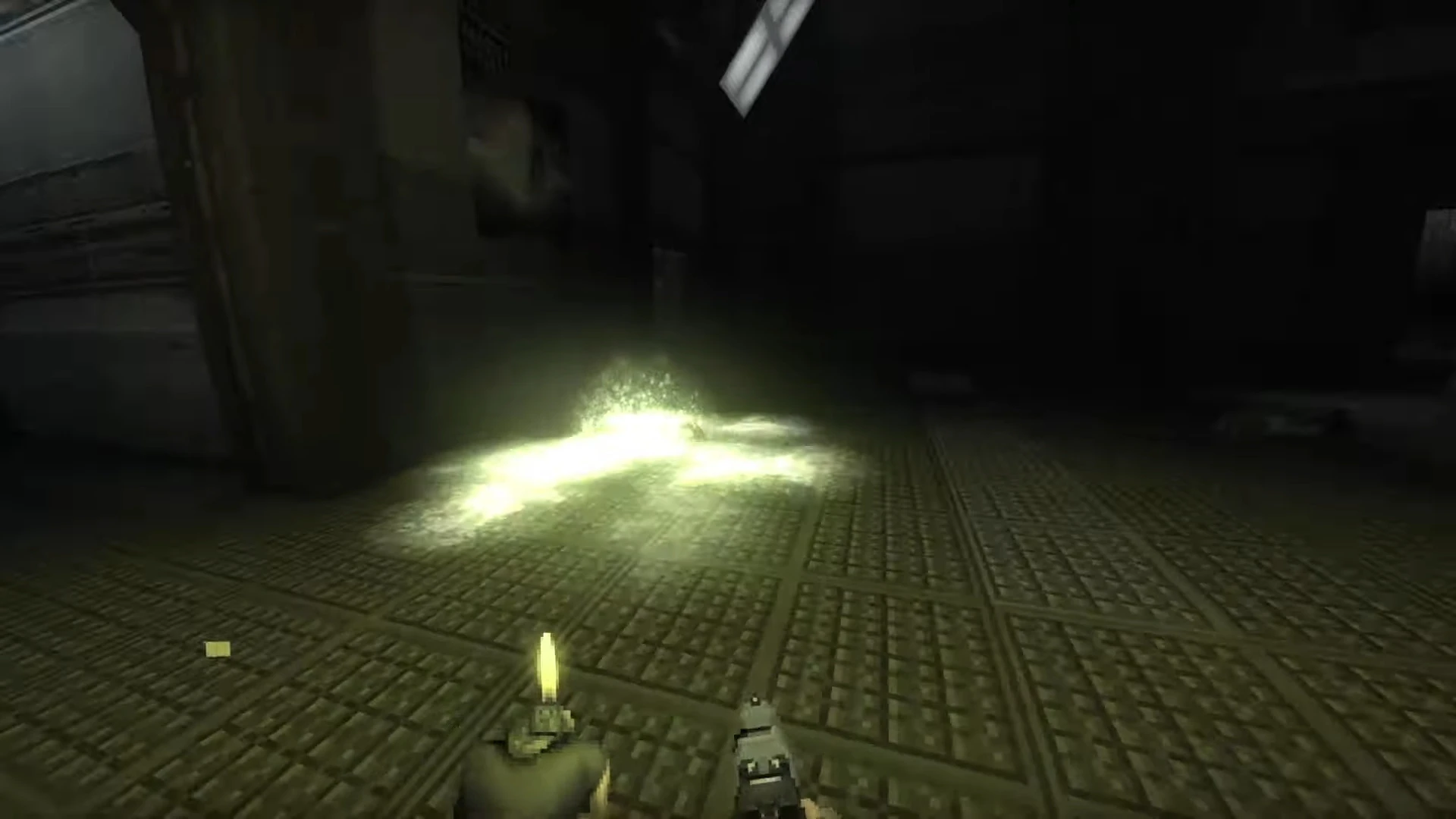 First-person view showing a dimly lit industrial floor with a faint glowing light in Doom mod
