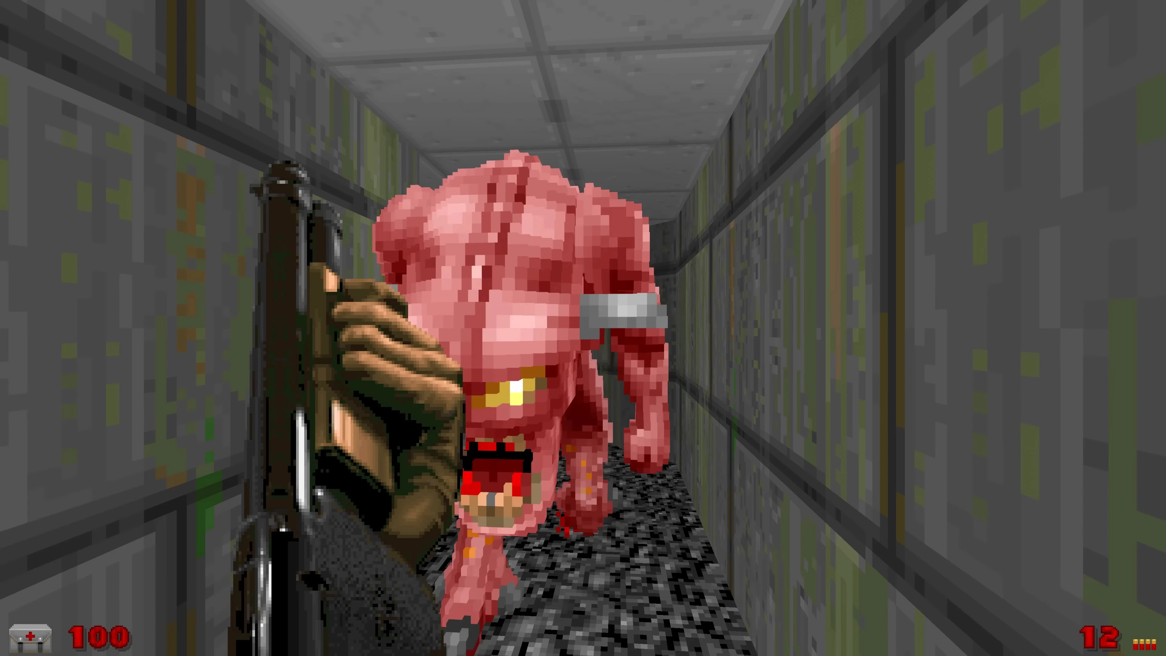 Player holding shotgun facing a pink pixelated demon in a narrow gray corridor in Doom with Voxel Doom mod