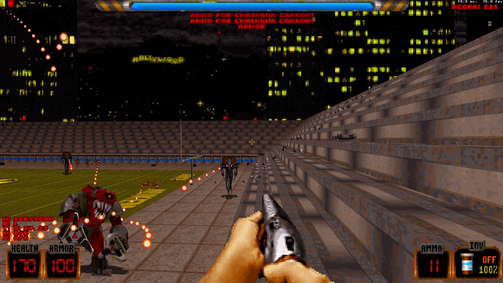 Вид від першої особи з моду Duke Nukem 3D з дробовиком, здоров'ям 170, бронею 100 та прибульцями на міському стадіоні