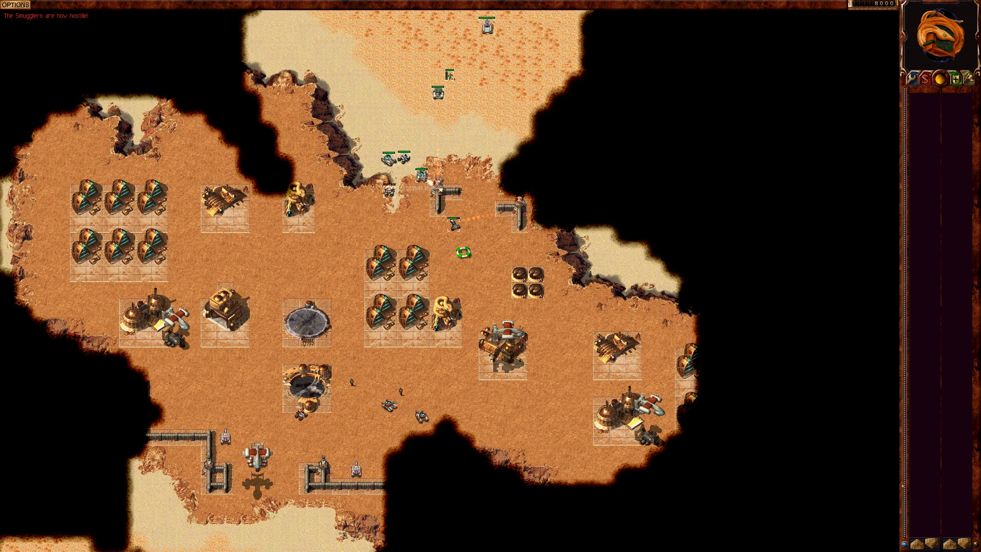 Gameplay-Screenshot einer Wüstenbasisverteidigung mit Einheiten und Gebäuden in Dune 2000 GruntMods Edition