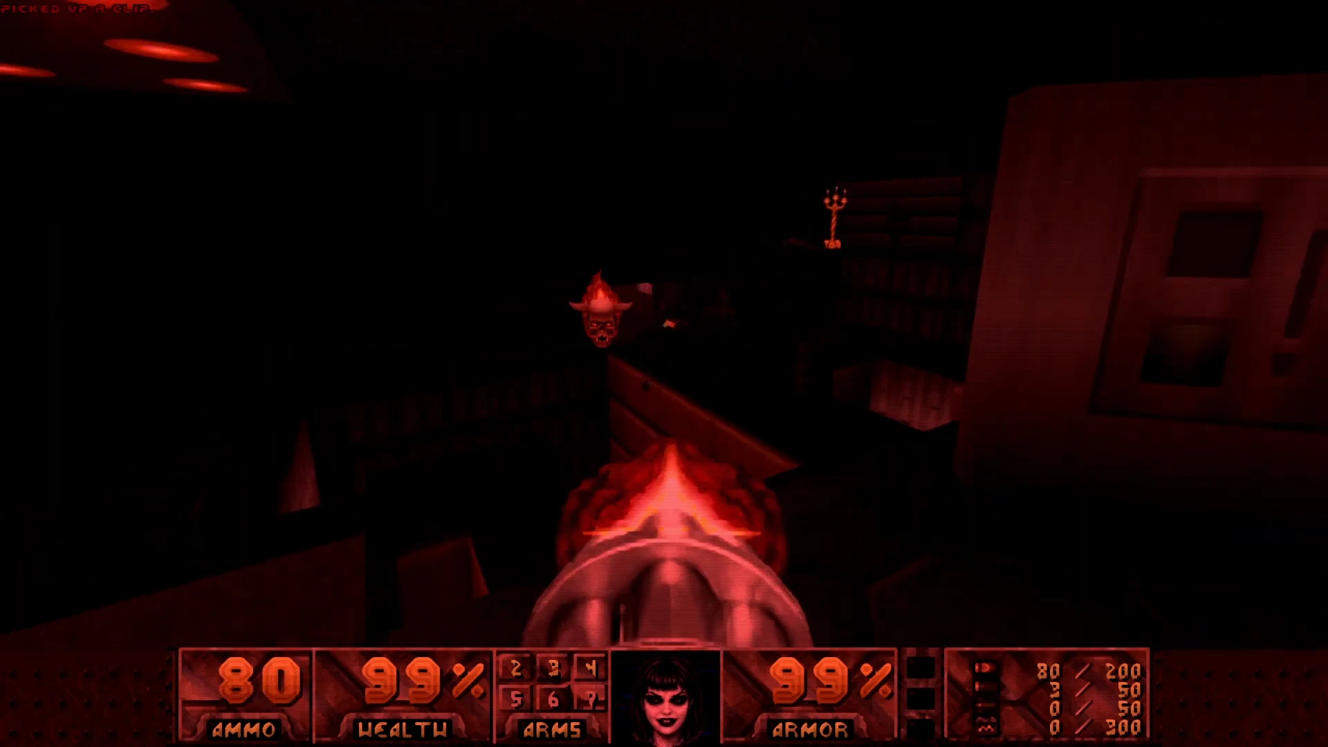 First-person view from Doom showing red tinted dark level with enemy approaching