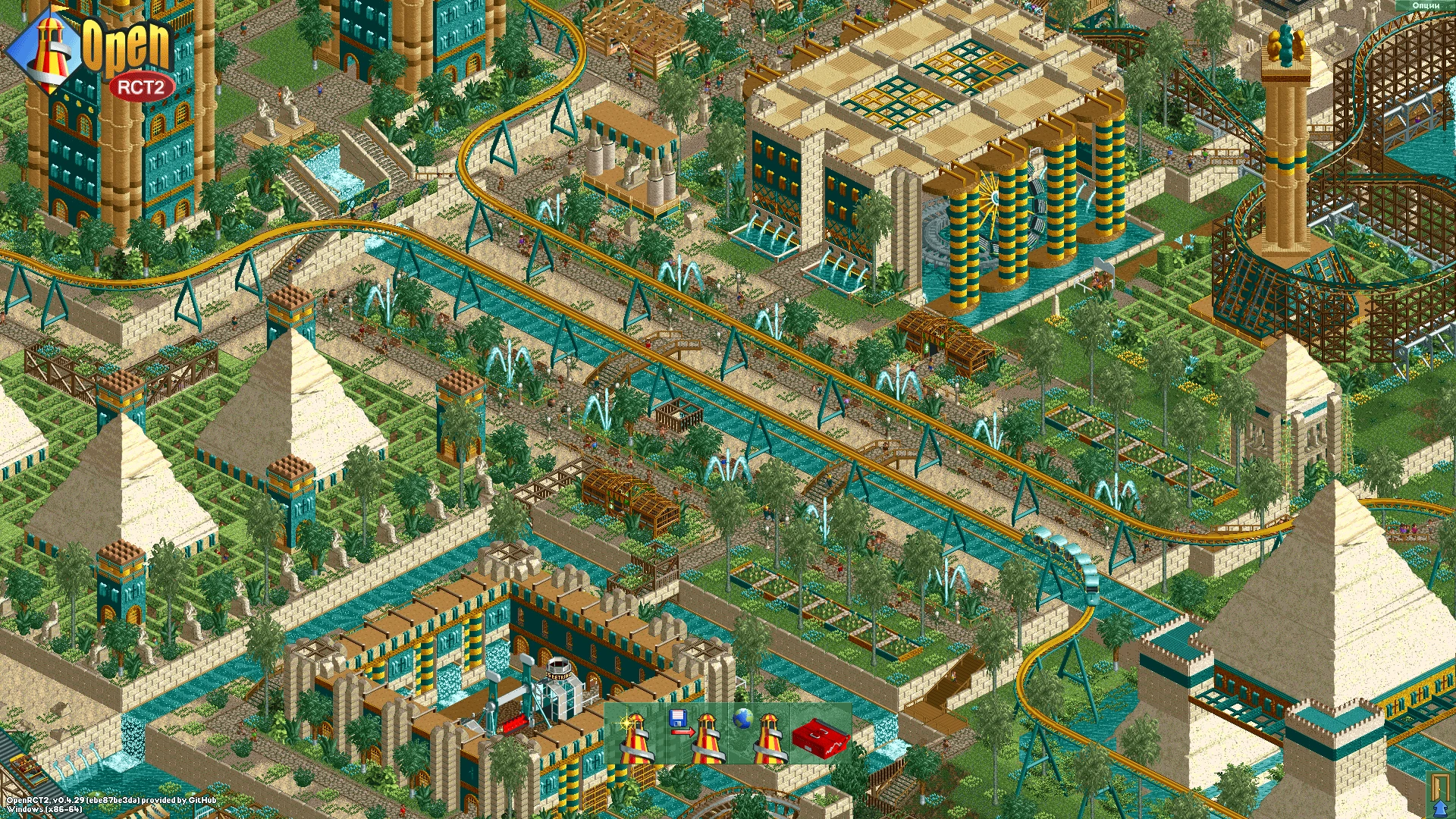 Zrzut ekranu przedstawiający kolejkę górską w staroegipskim stylu z kanałami, fontannami, ogrodami i piramidami w RollerCoaster Tycoon 2 przez OpenRCT2