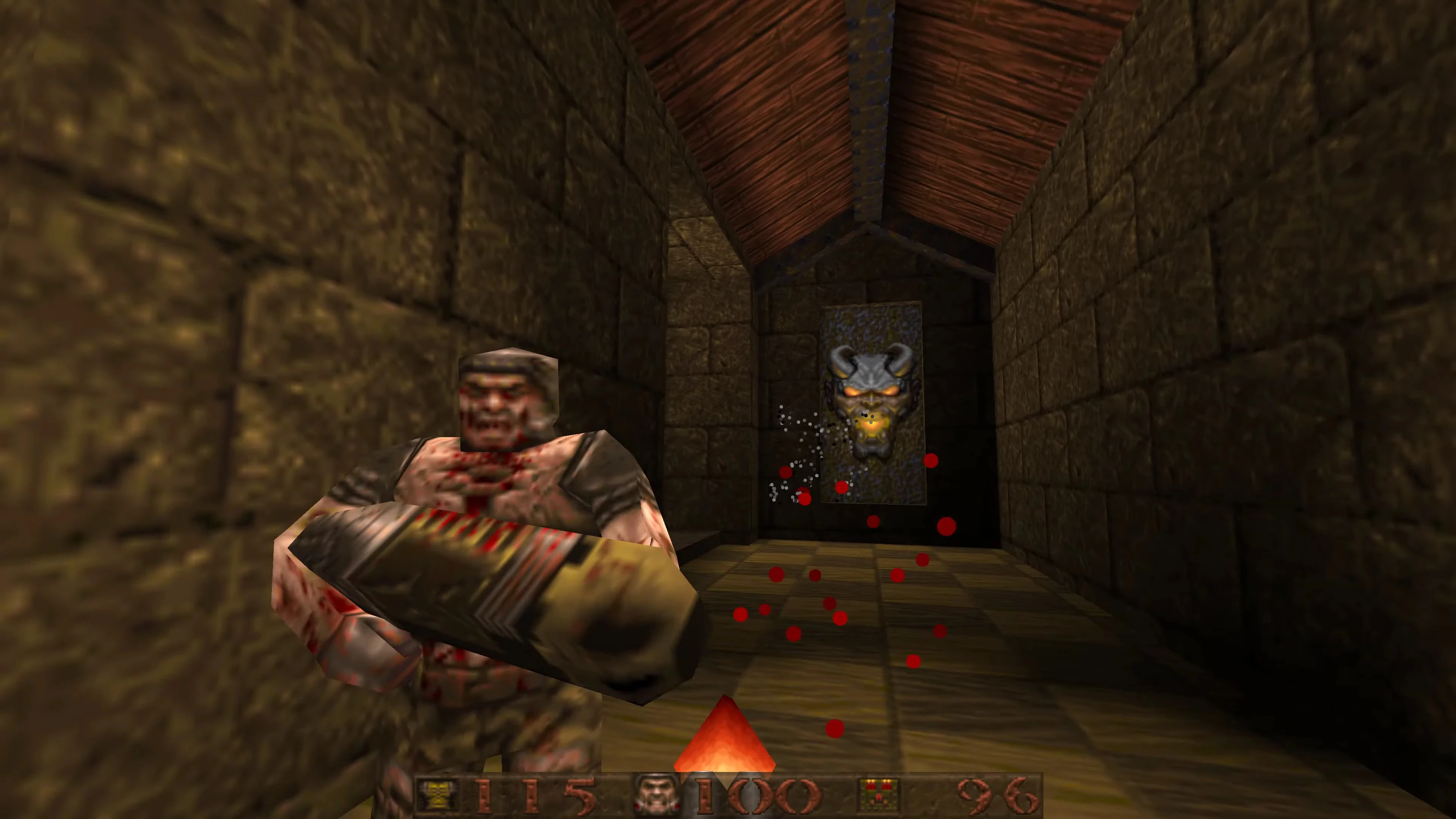 Quake gameplay screenshot showing a bloodied enemy attacking in a stone corridor with a demonic door