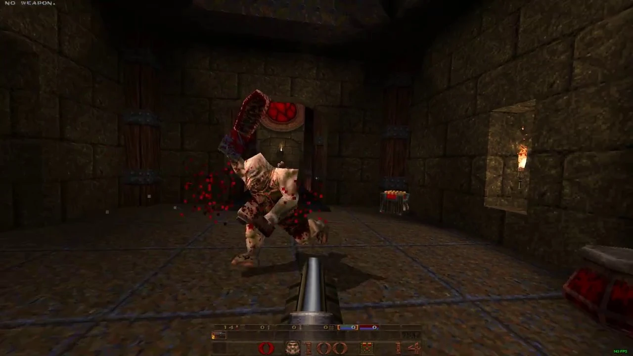 First-person view of Quake gameplay showing a demon enemy attacking inside a stone room