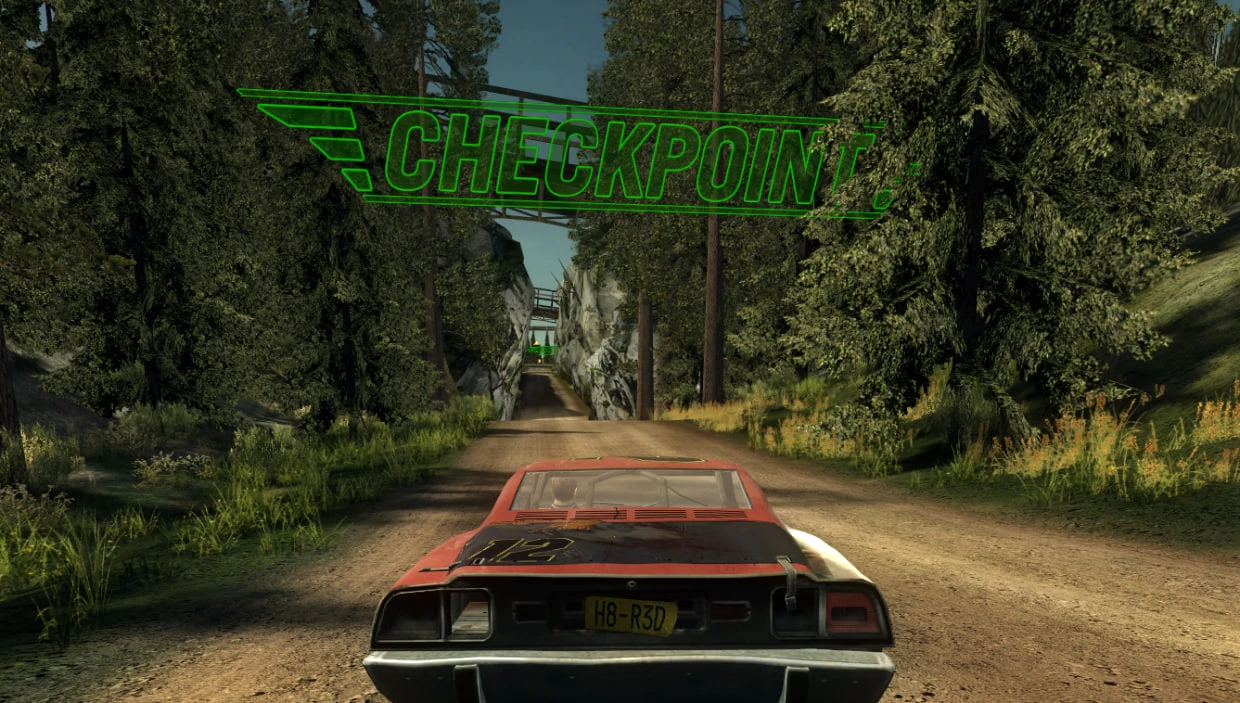 View from behind a red race car driving on a dirt track under a glowing green checkpoint sign in FlatOut 2 Carnage Mode