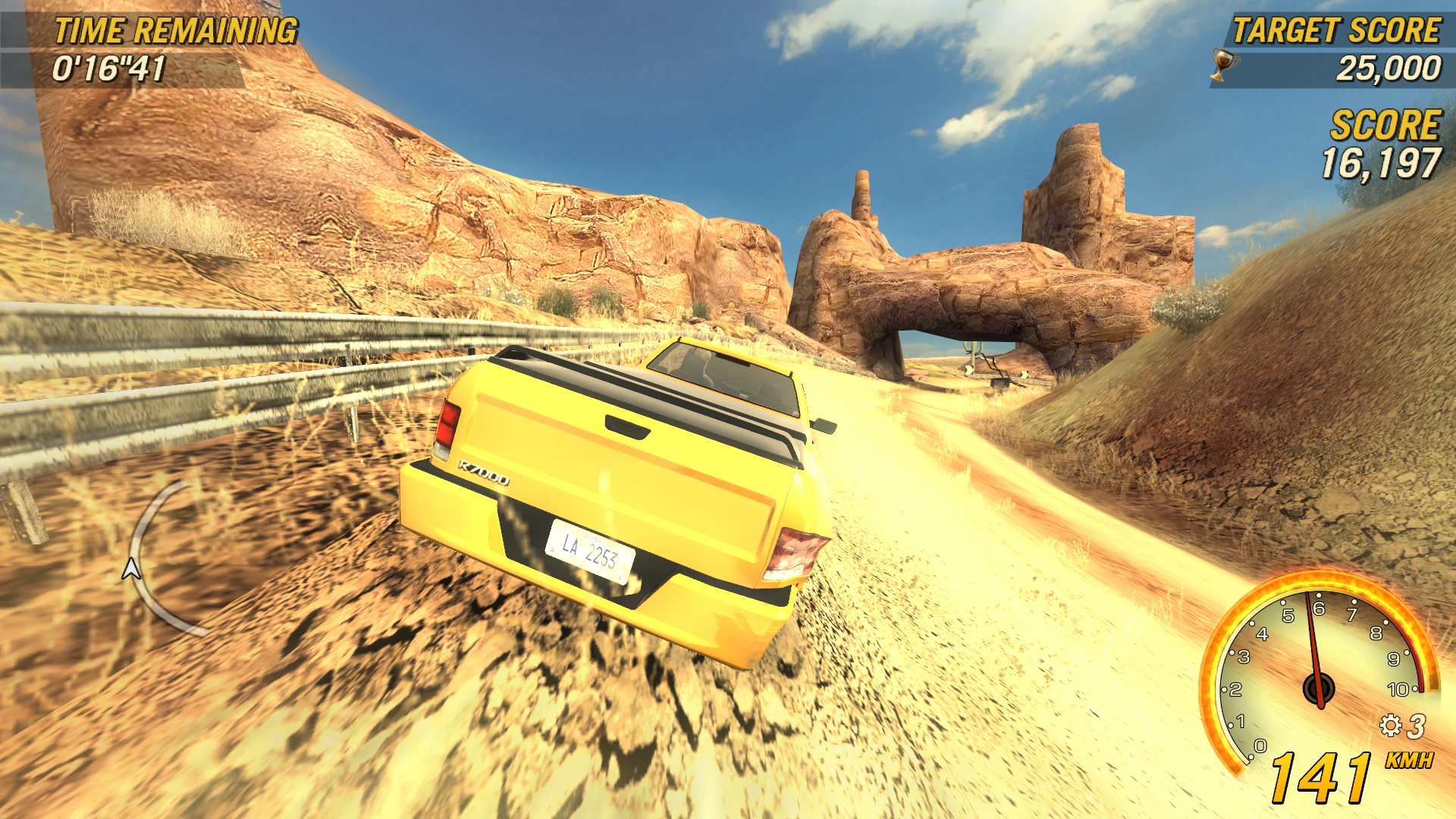 Yellow pickup truck racing on a desert track with rocky formations and speedometer showing 141 km/h in FlatOut 2