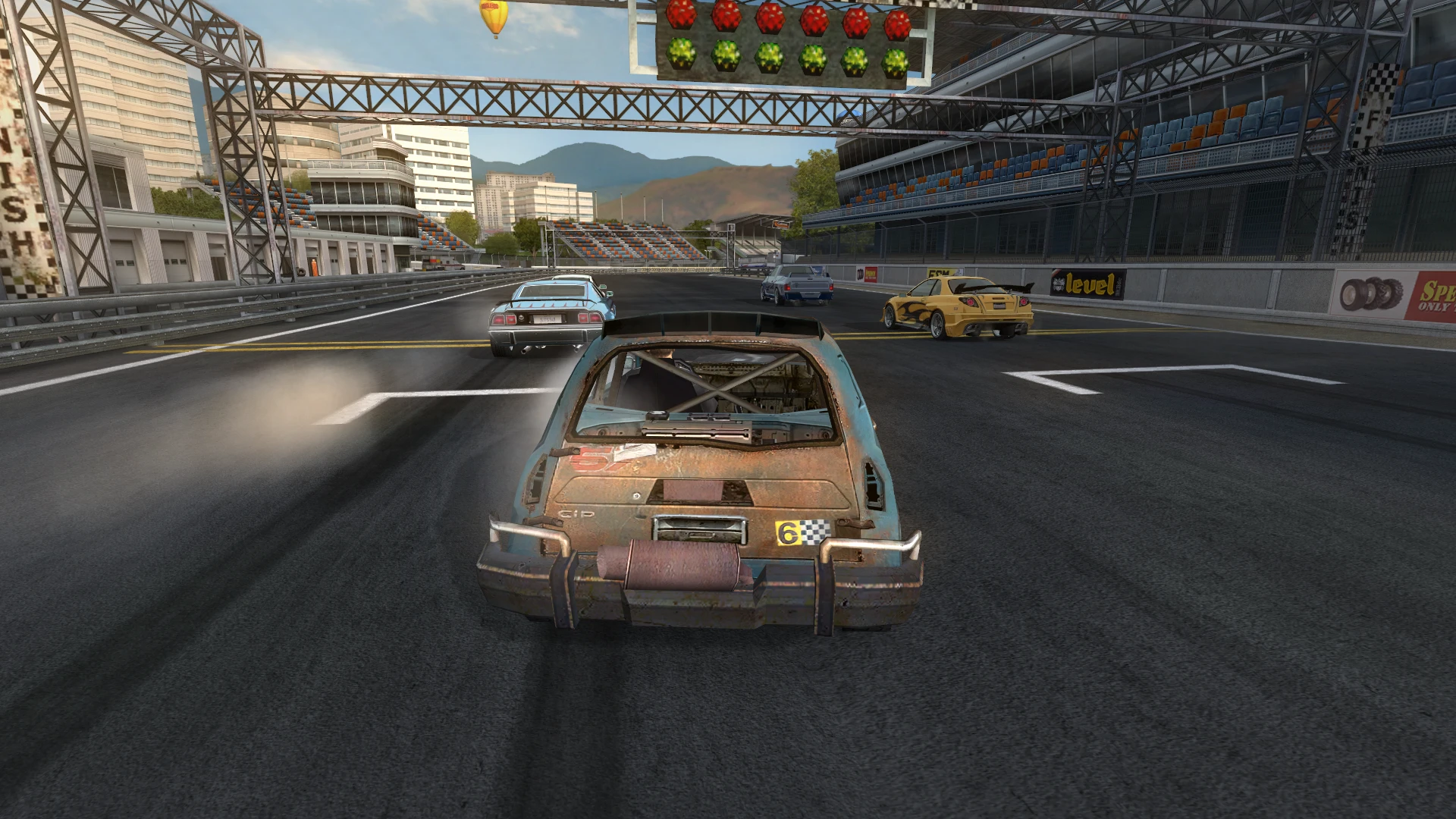Screenshot of a race start with various normal cars lined up on the asphalt track in FlatOut 2 mod