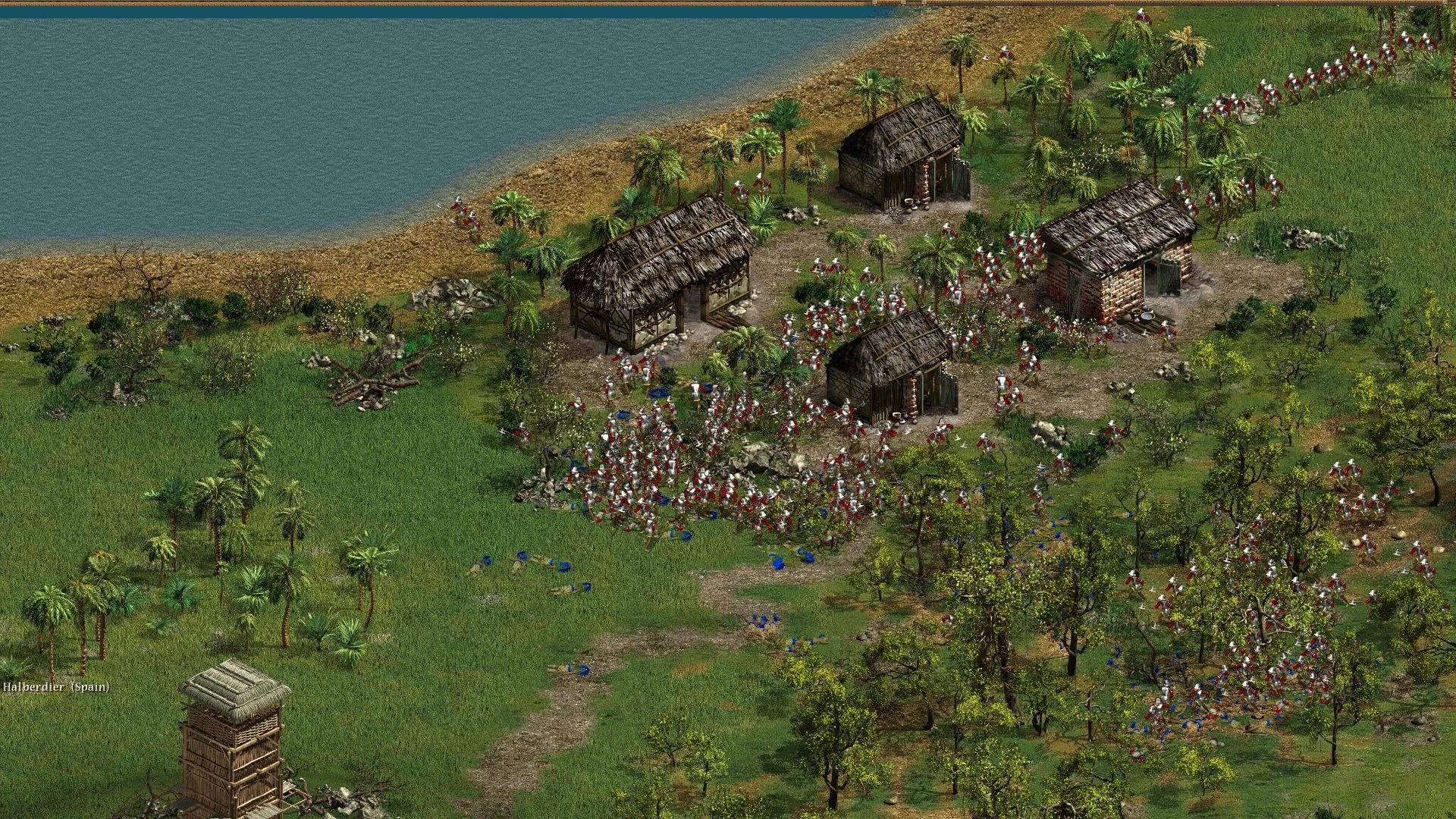 Captura de pantalla con cientos de soldados luchando junto a edificios y costa en American Conquest 2002
