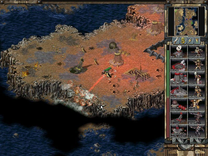 Spielbildschirm zeigt Nod-Einheiten, die eine Klippenbasis mit Gebäuden und Ozean in Command & Conquer Tiberian Sun angreifen