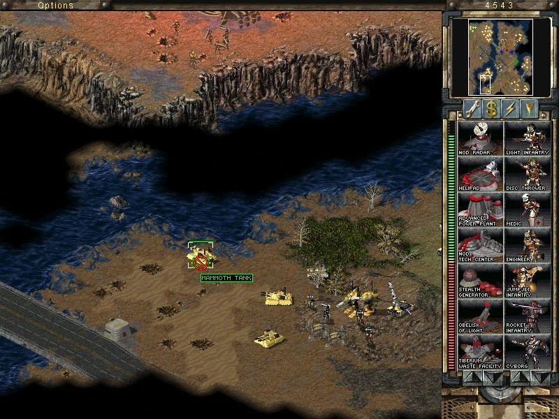 Spielansicht zeigt einen Mammut-Panzer und Infanterieeinheiten nahe einem Fluss mit sichtbarer Benutzeroberfläche in Command & Conquer Tiberian Sun