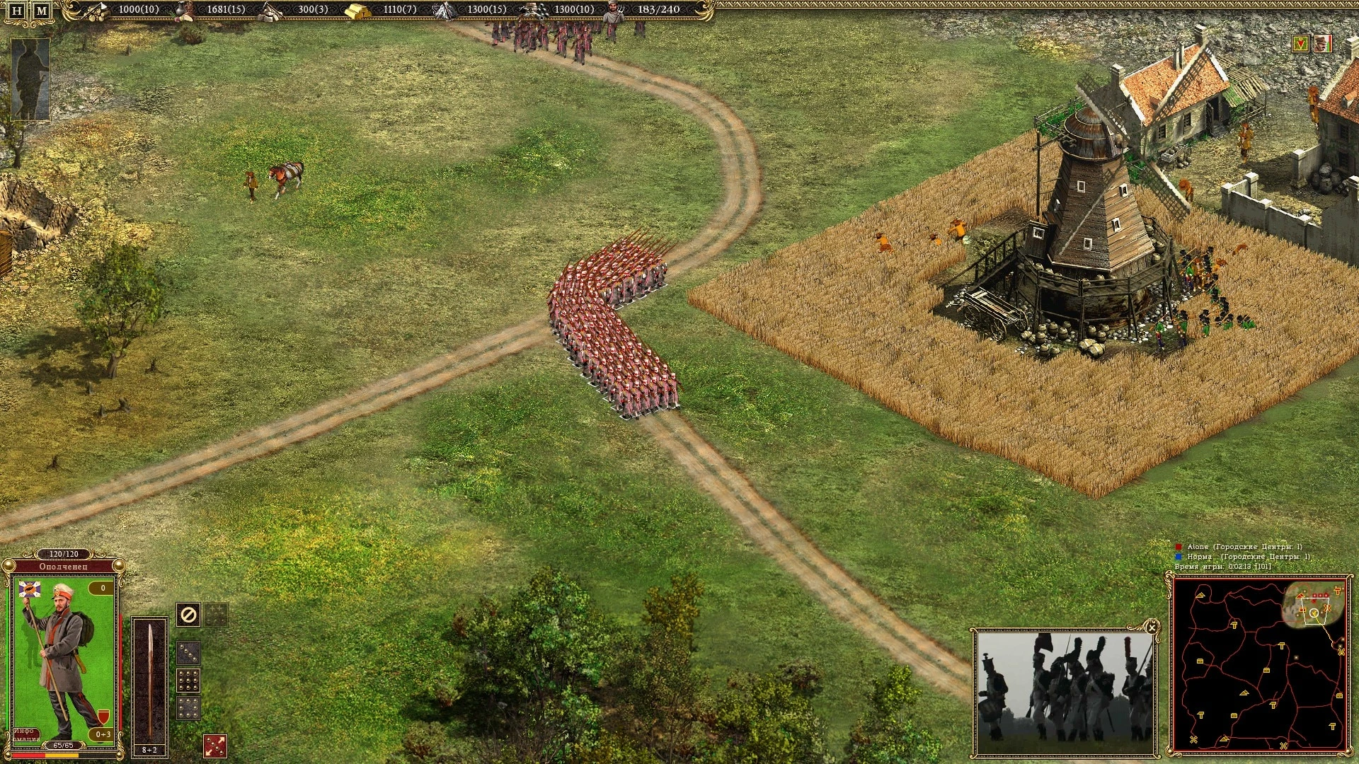 Draufsicht auf Soldaten in Formation neben einer Windmühle und Gebäuden mit Spiel-HUD und Mini-Karte in Cossacks II Napoleonic Wars