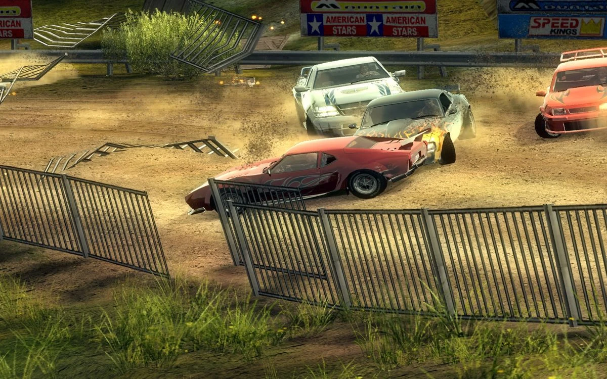 FlatOut 2 screenshot: cars crashing into each other on a dusty arena surrounded by metal fences